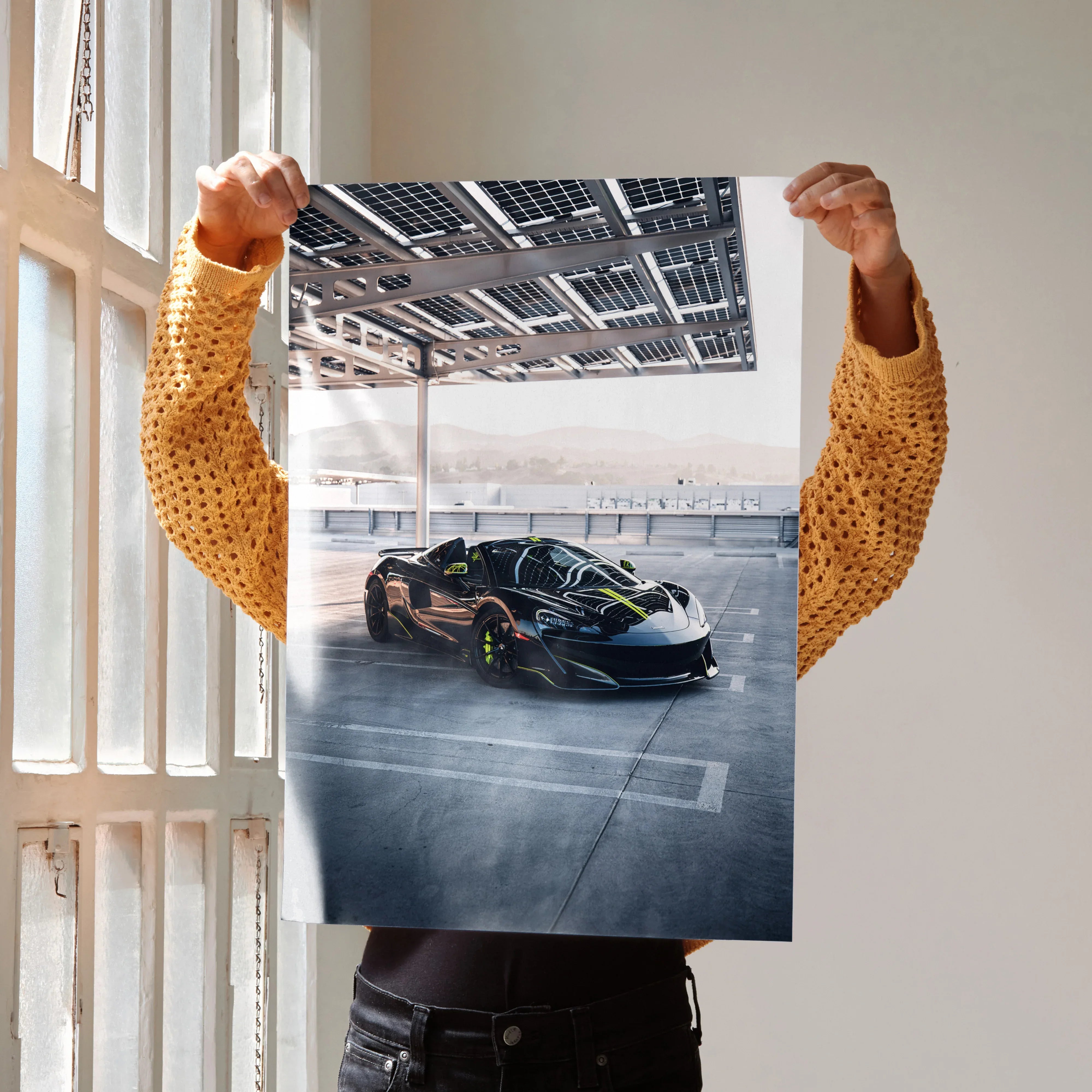 McLaren 600LT supercar poster showing sleek black sports car under overhead structure, premium wall art.