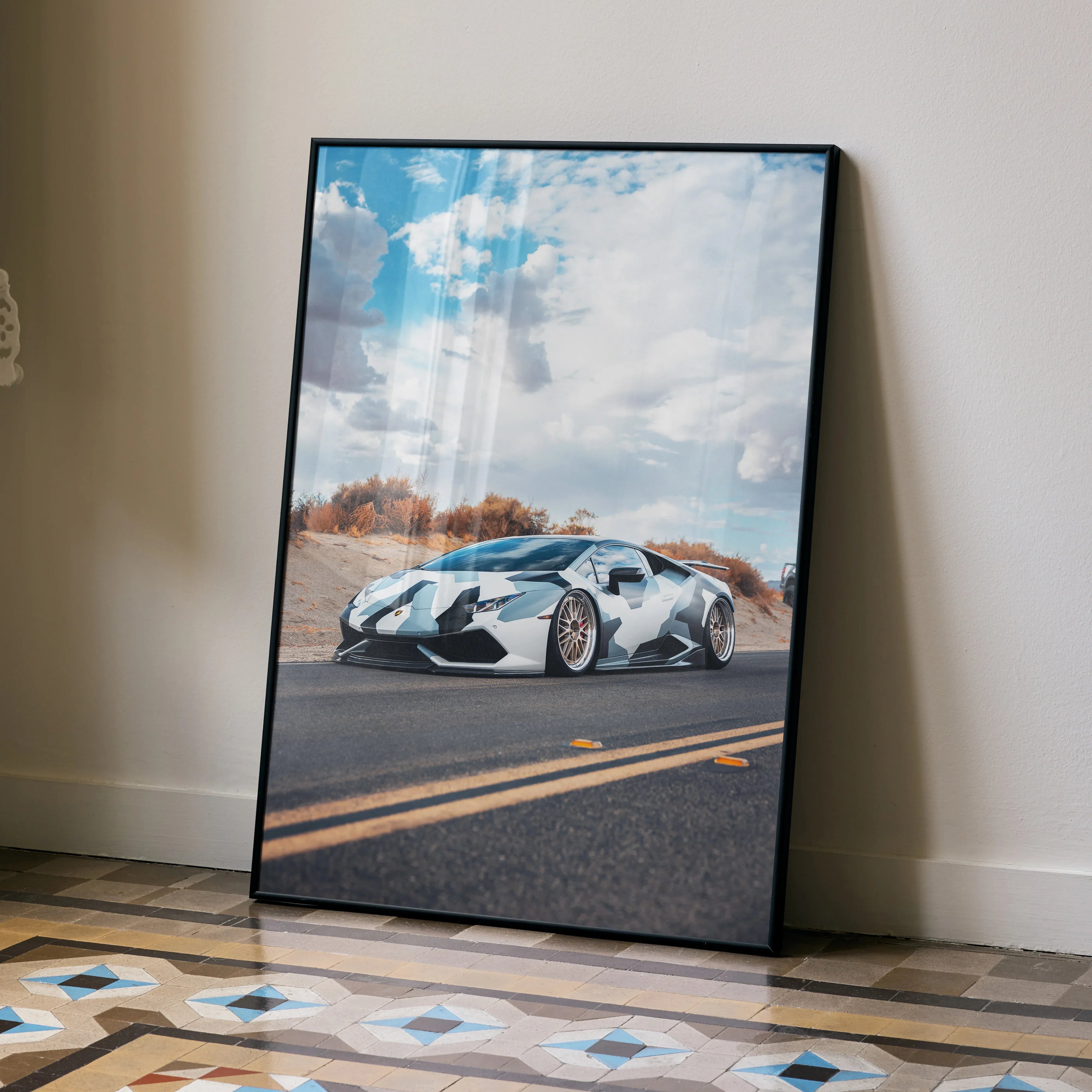 Lamborghini Huracan poster featuring white sports car on desert road under blue sky, modern wall art.