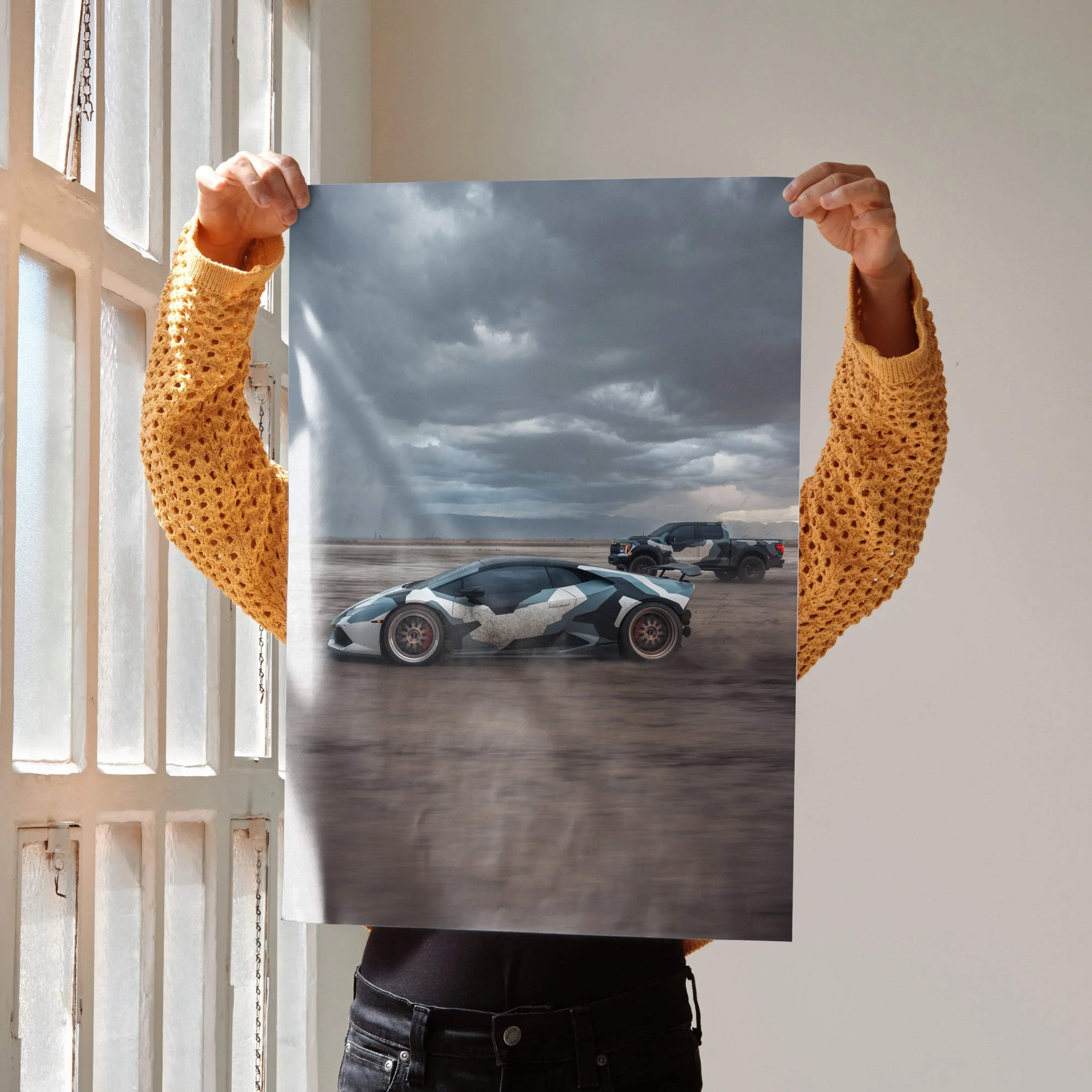 A sleek black and white Lamborghini Huracan high resolution car poster showing a dynamic drift under stormy skies