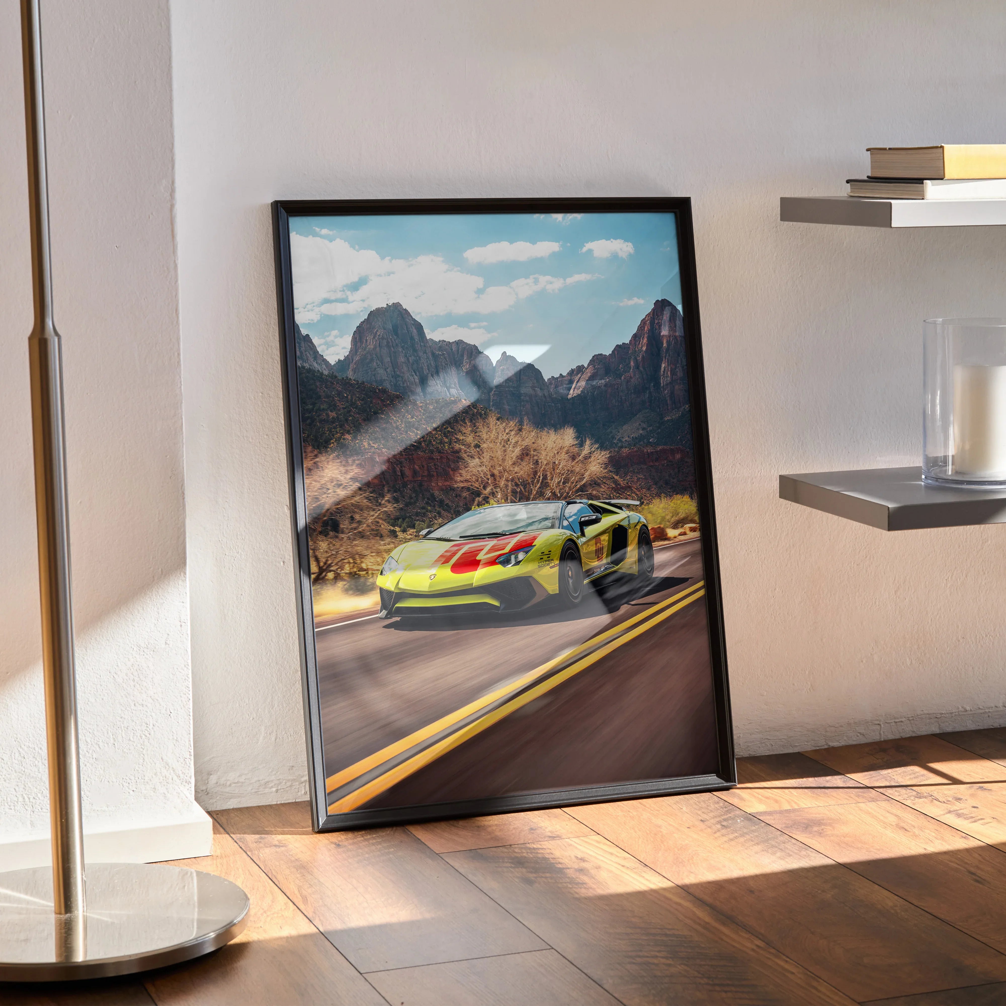 Lamborghini Aventador SVJ driving on mountain road poster wall art in black frame.