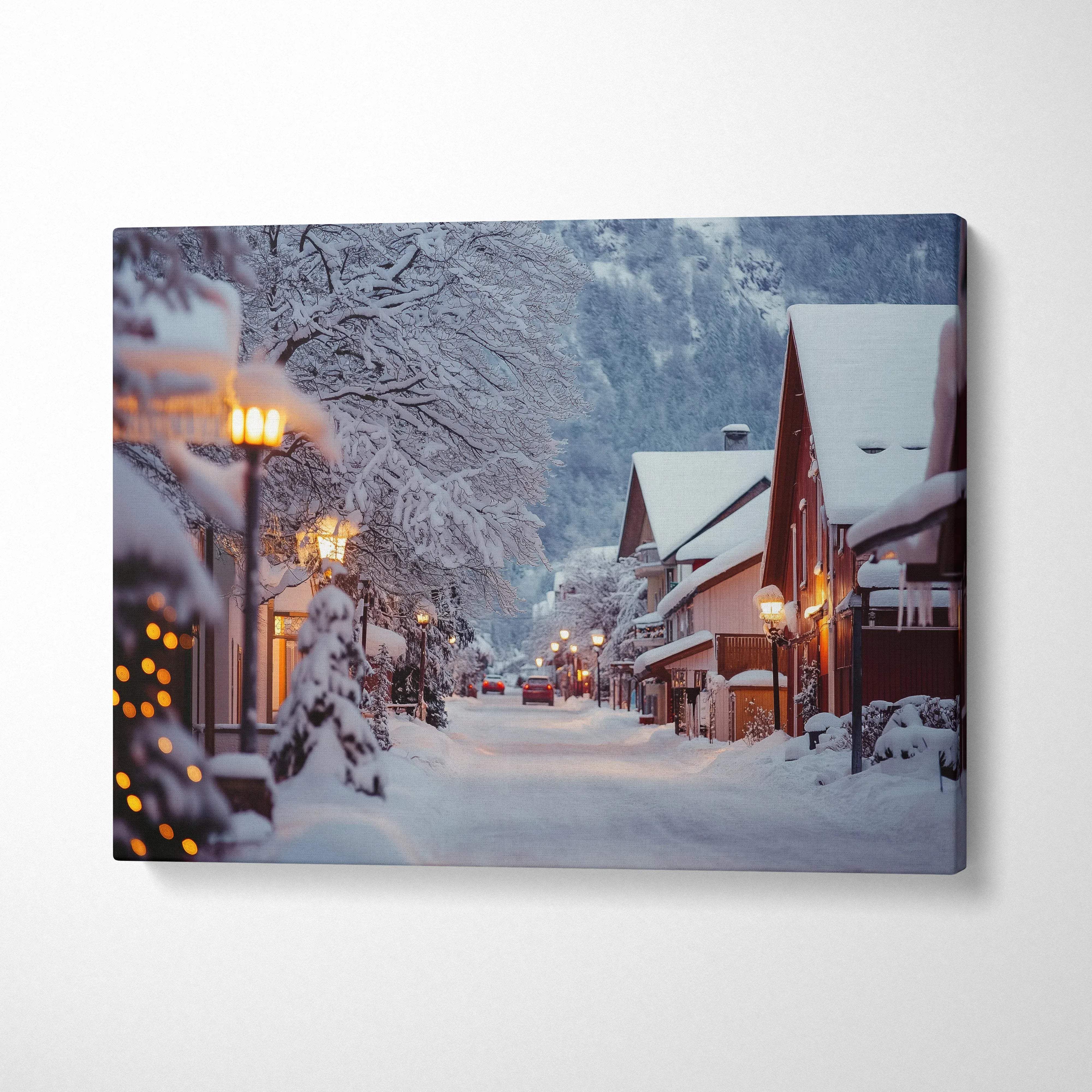 Winter snowy mountain town canvas wall art with cozy lights and snow-covered rooftops decor.