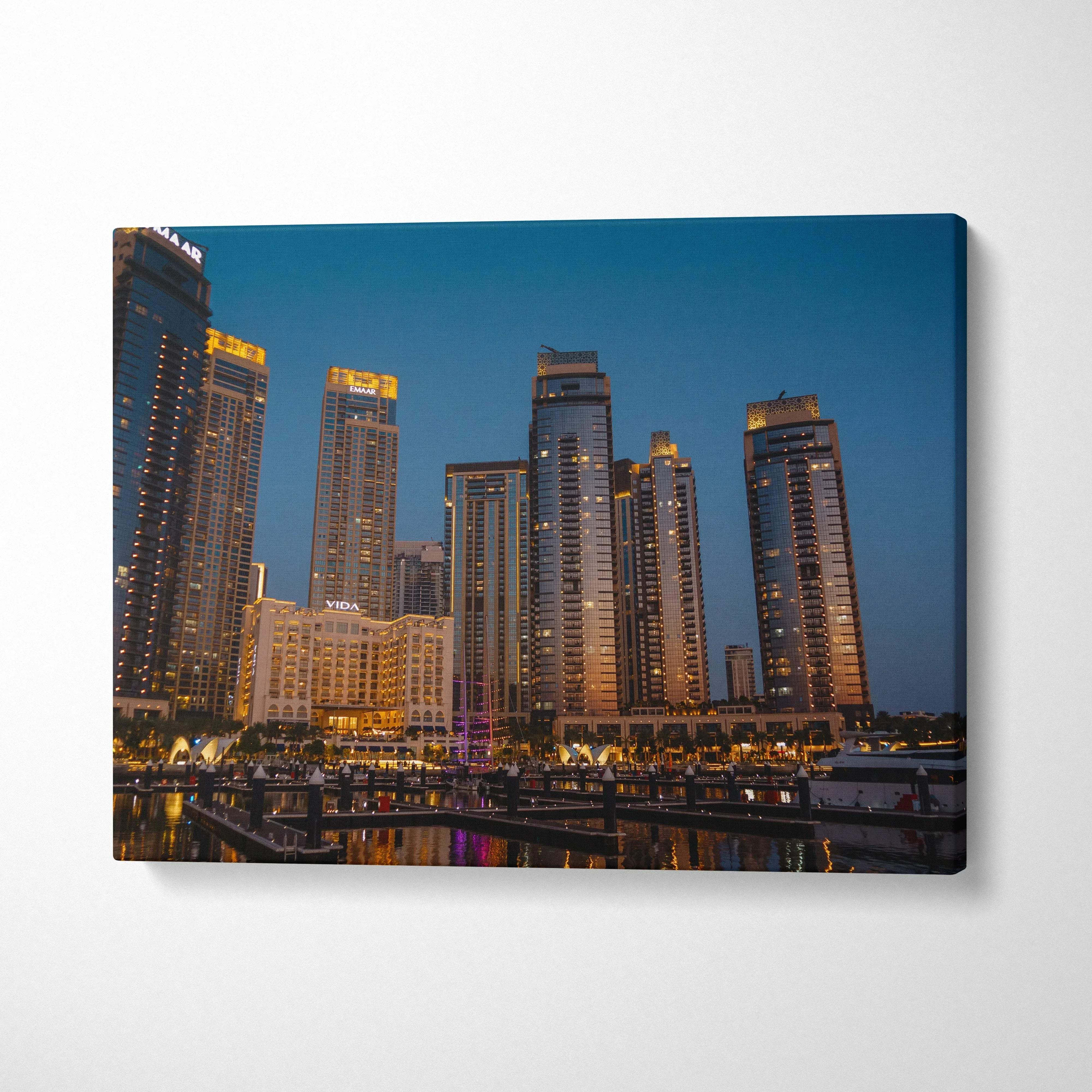 City skyline at dusk with illuminated high-rise buildings on canvas wall art print.