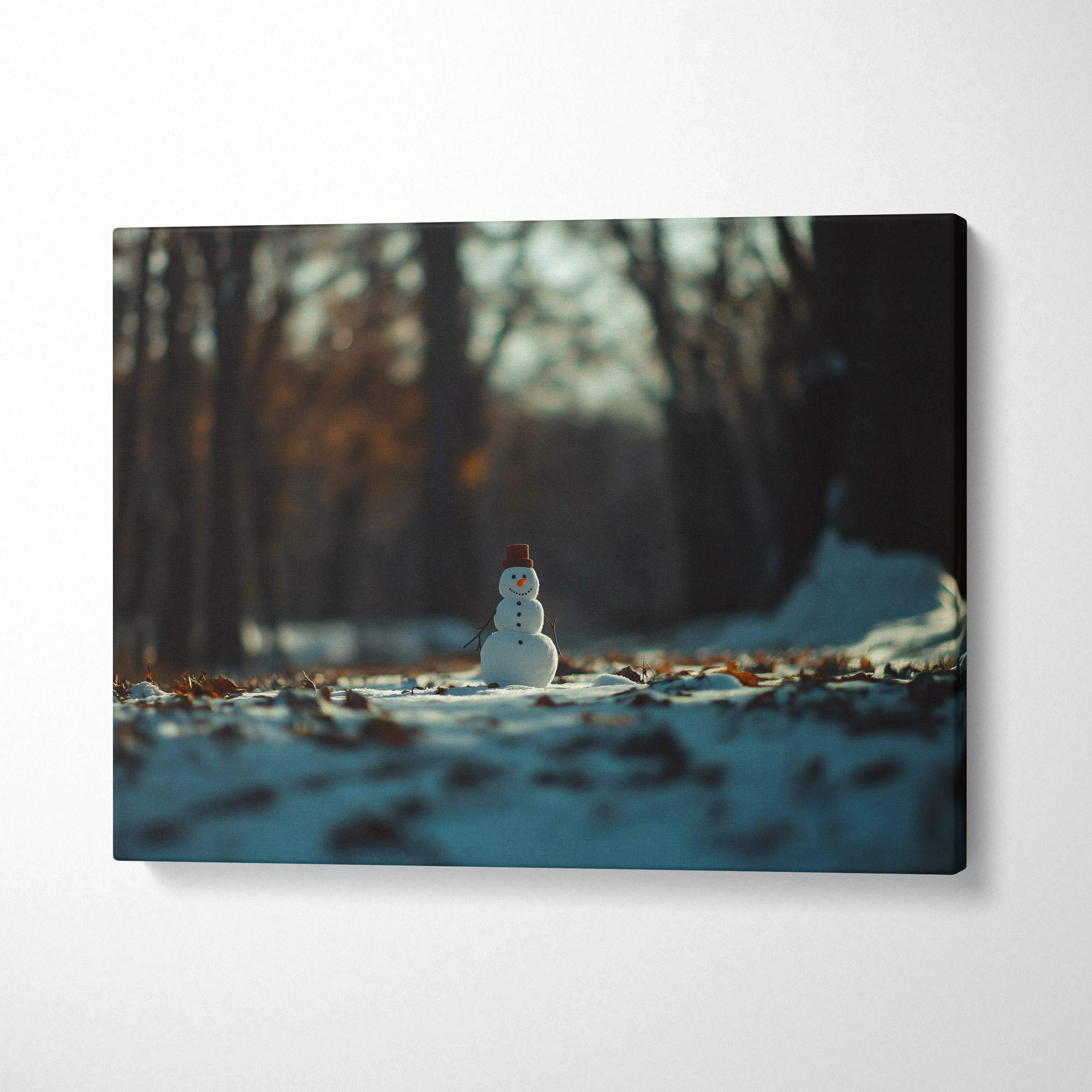 Canvas wall art featuring a small snowman in a snowy forest with warm sunlight decor.