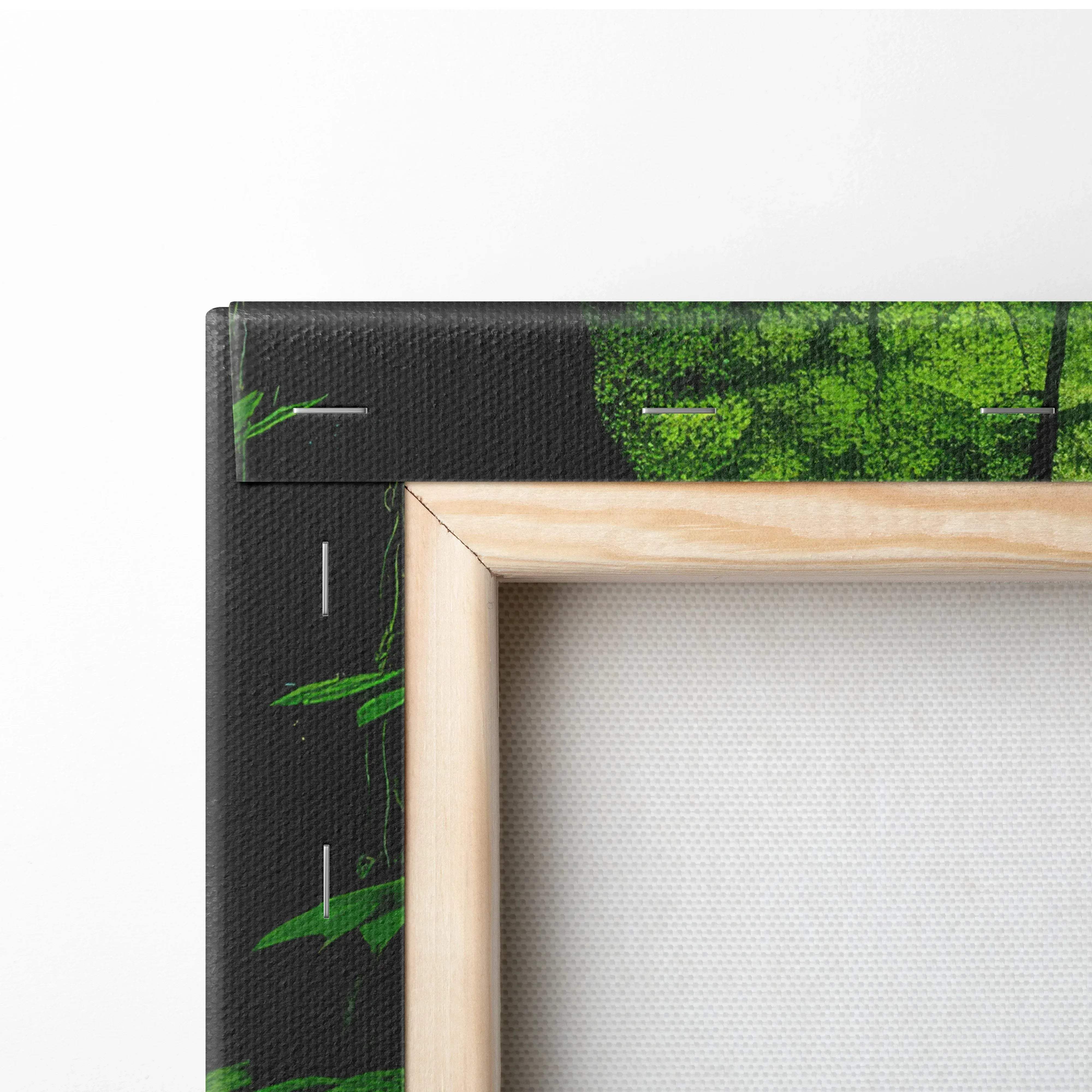 Light wood-framed canvas print featuring a vibrant green forest scene with black backing and subtle leaf patterns