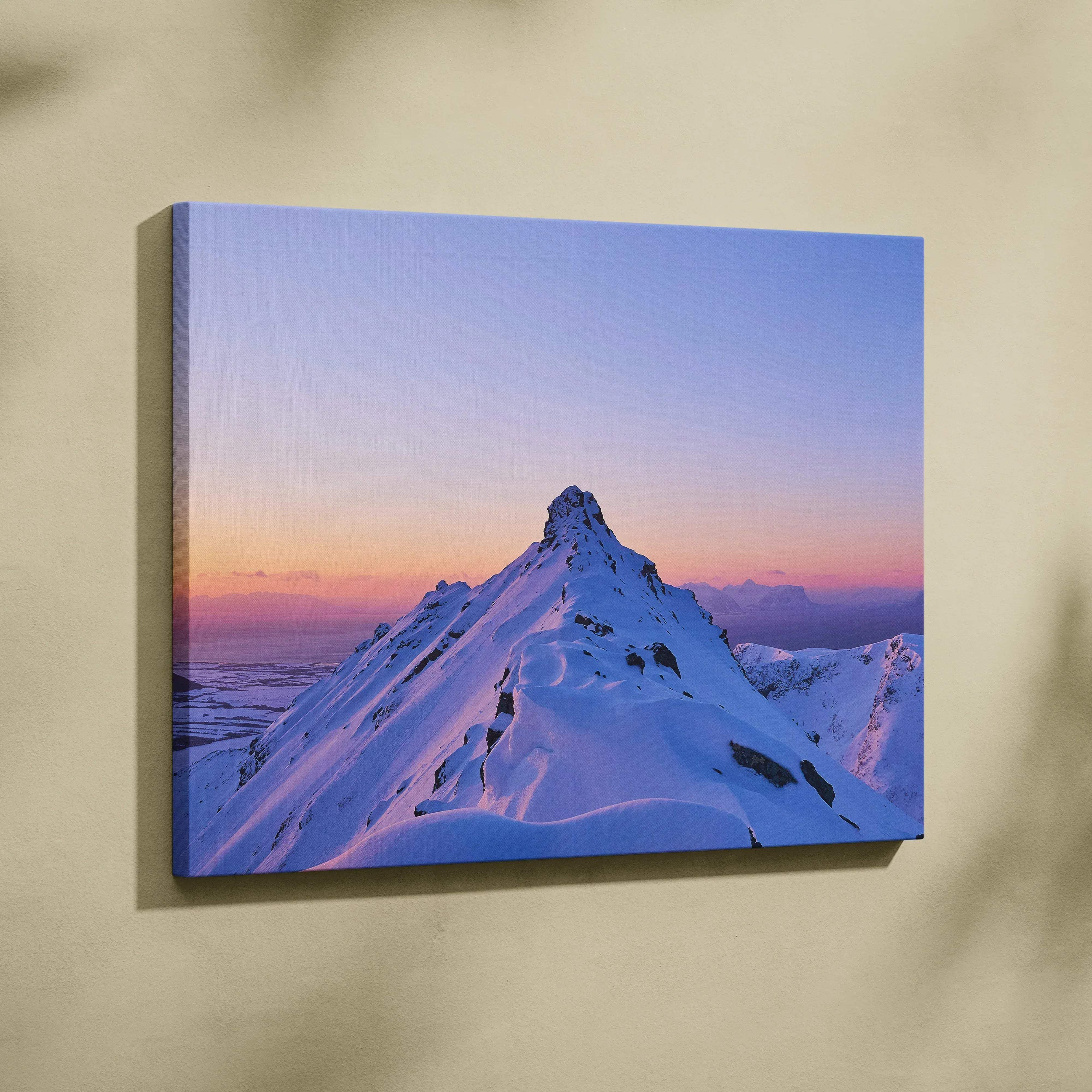 Winter mountain peak canvas wall art featuring a snow-capped peak with a gradient pink to purple sunset sky