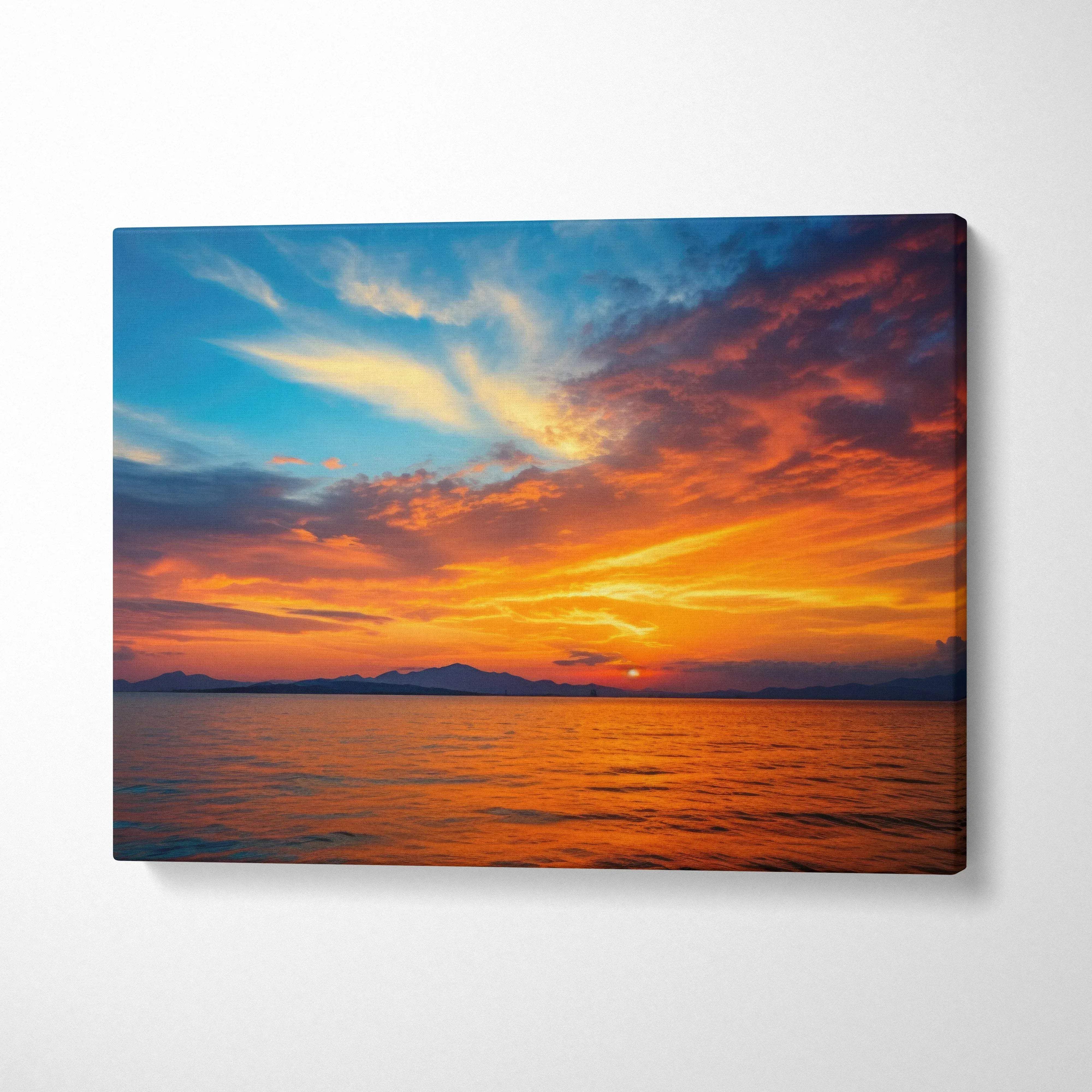Vibrant canvas wall art of coastal sunset seascape over orange blue sky