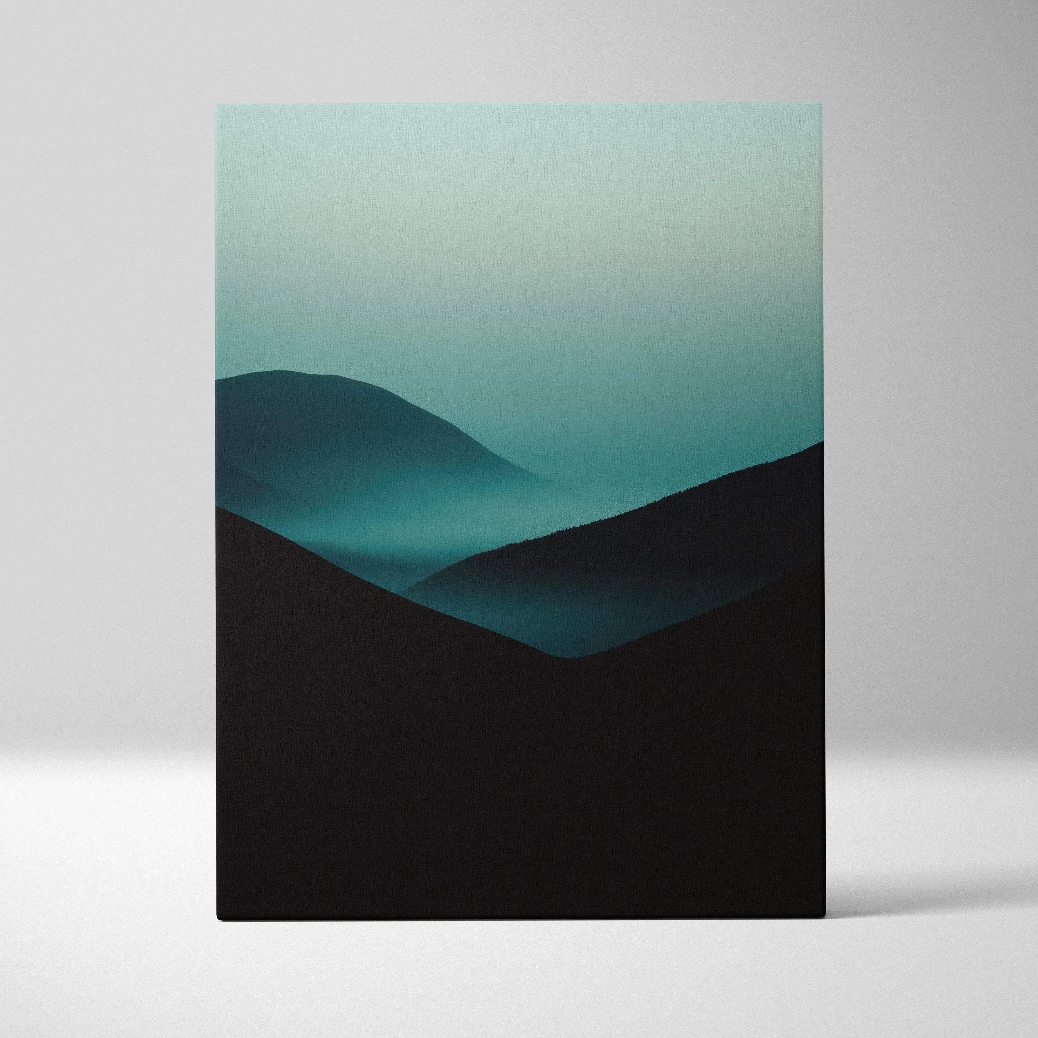 A minimalist canvas print of teal and black layered mountain silhouettes against a gradient green sky