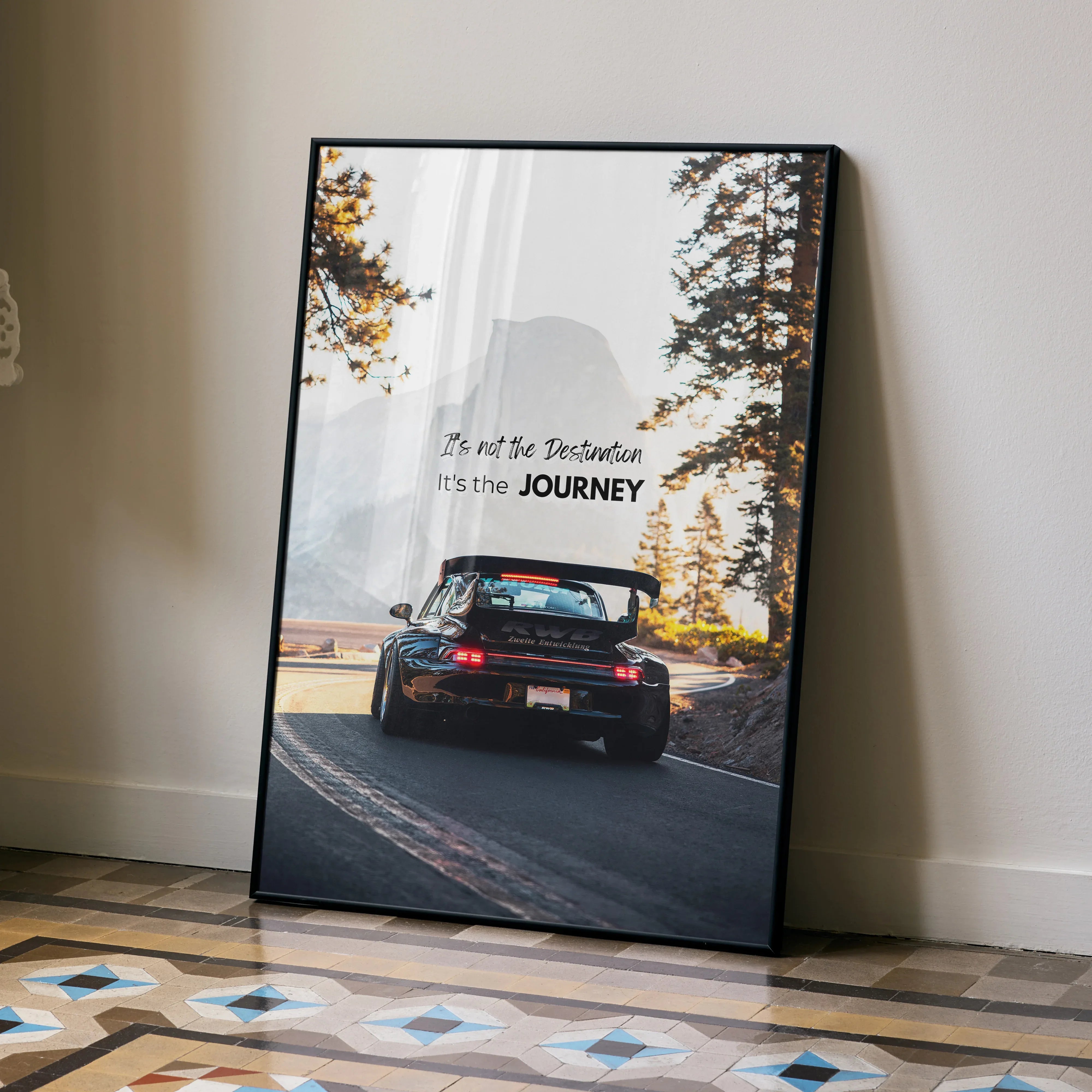 Motivational poster wall art featuring black RWB Porsche 911 driving on forest road with inspiring text.