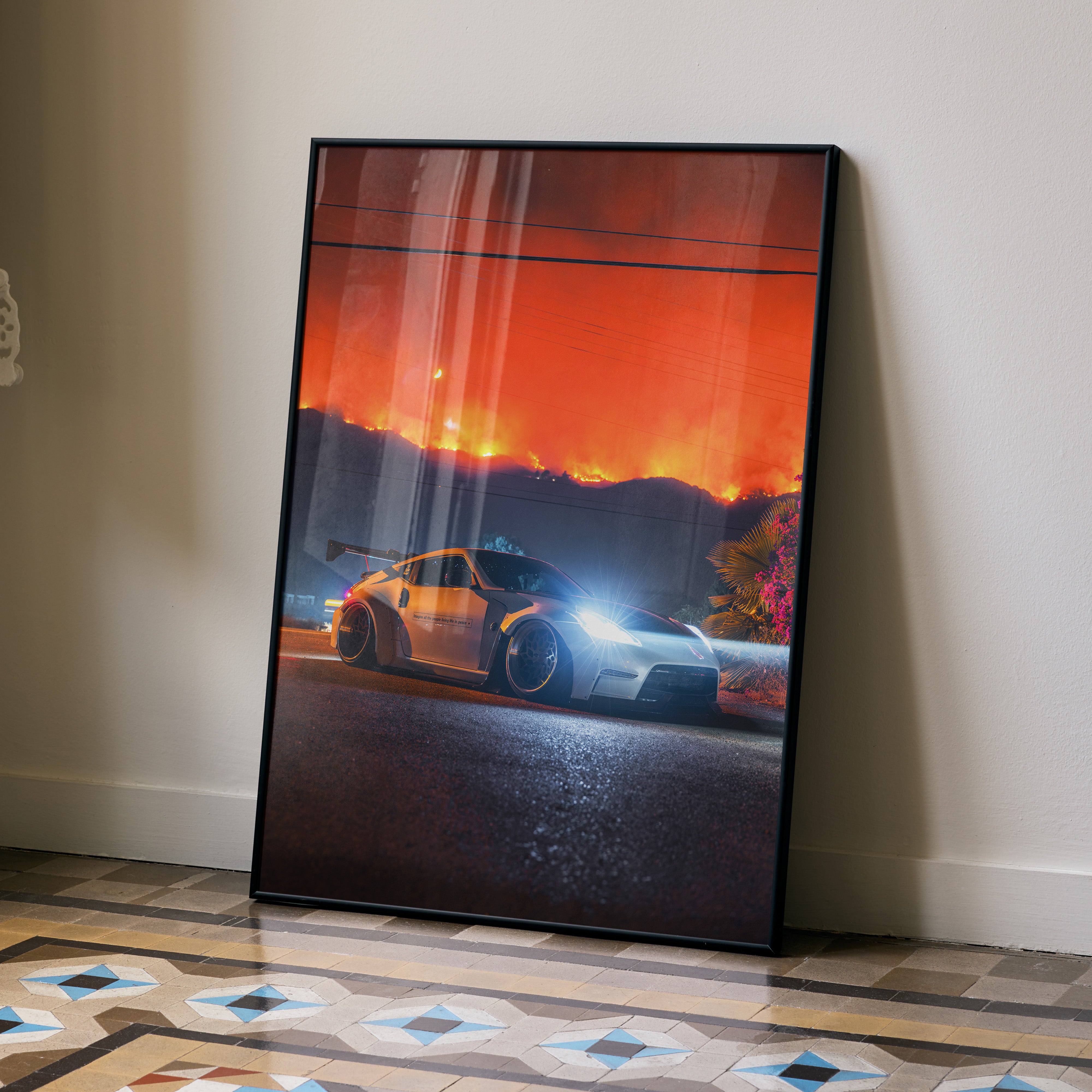 Nissan 370z car poster with glowing headlights against a fiery orange sky wall art.