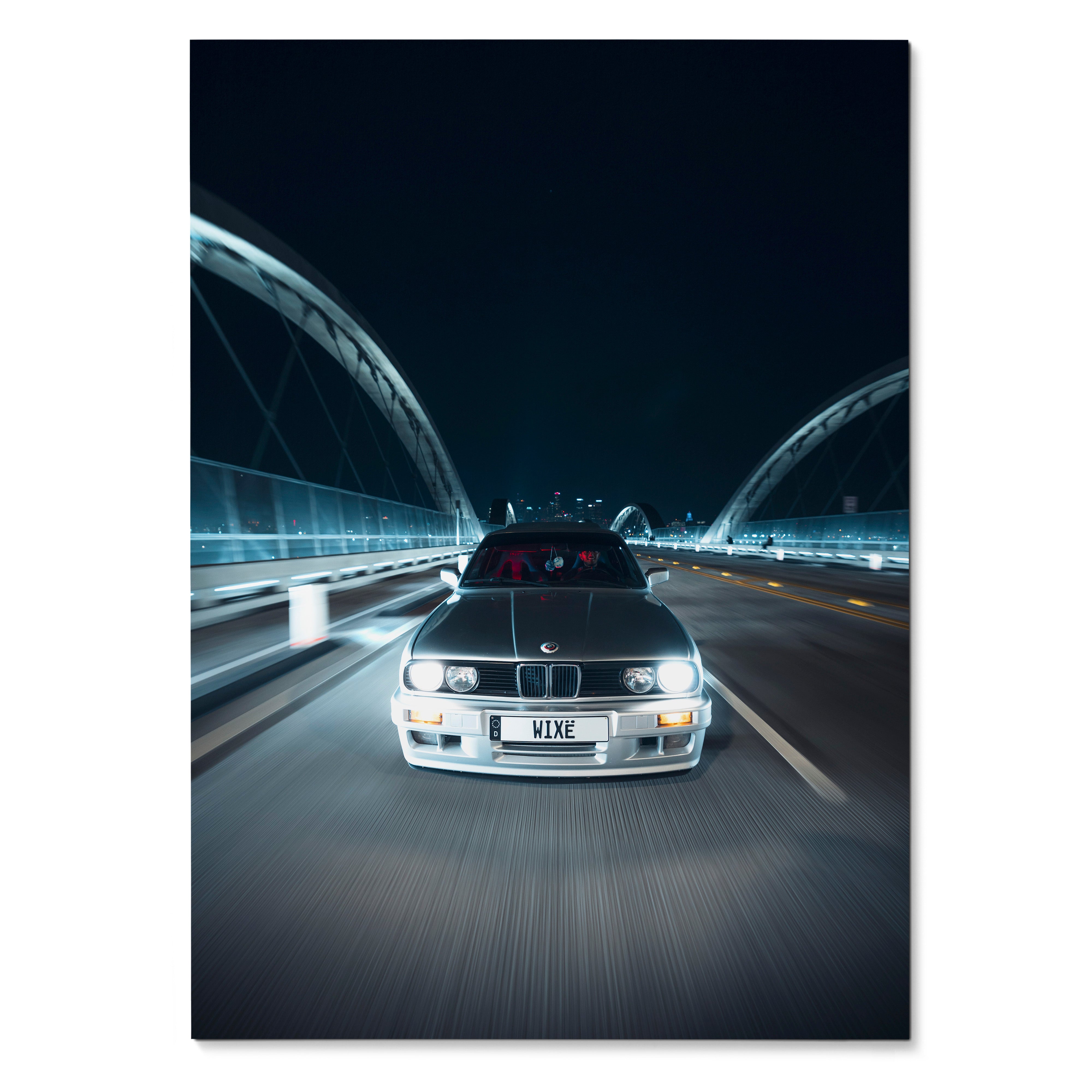 BMW E30 driving at night under illuminated bridge arches poster wall art.