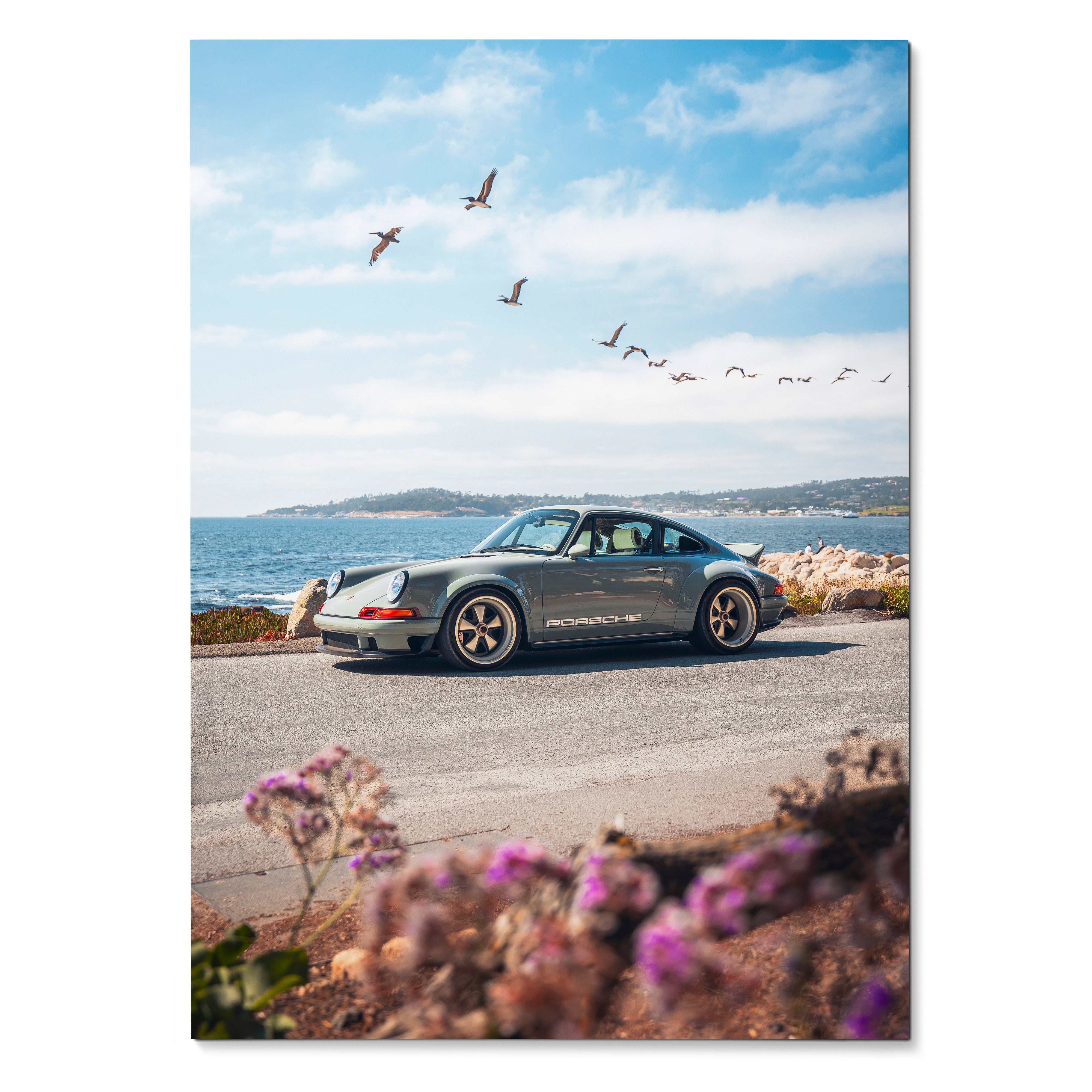 Porsche 911 classic car wall art poster with coastal road and flying birds in bright daylight.