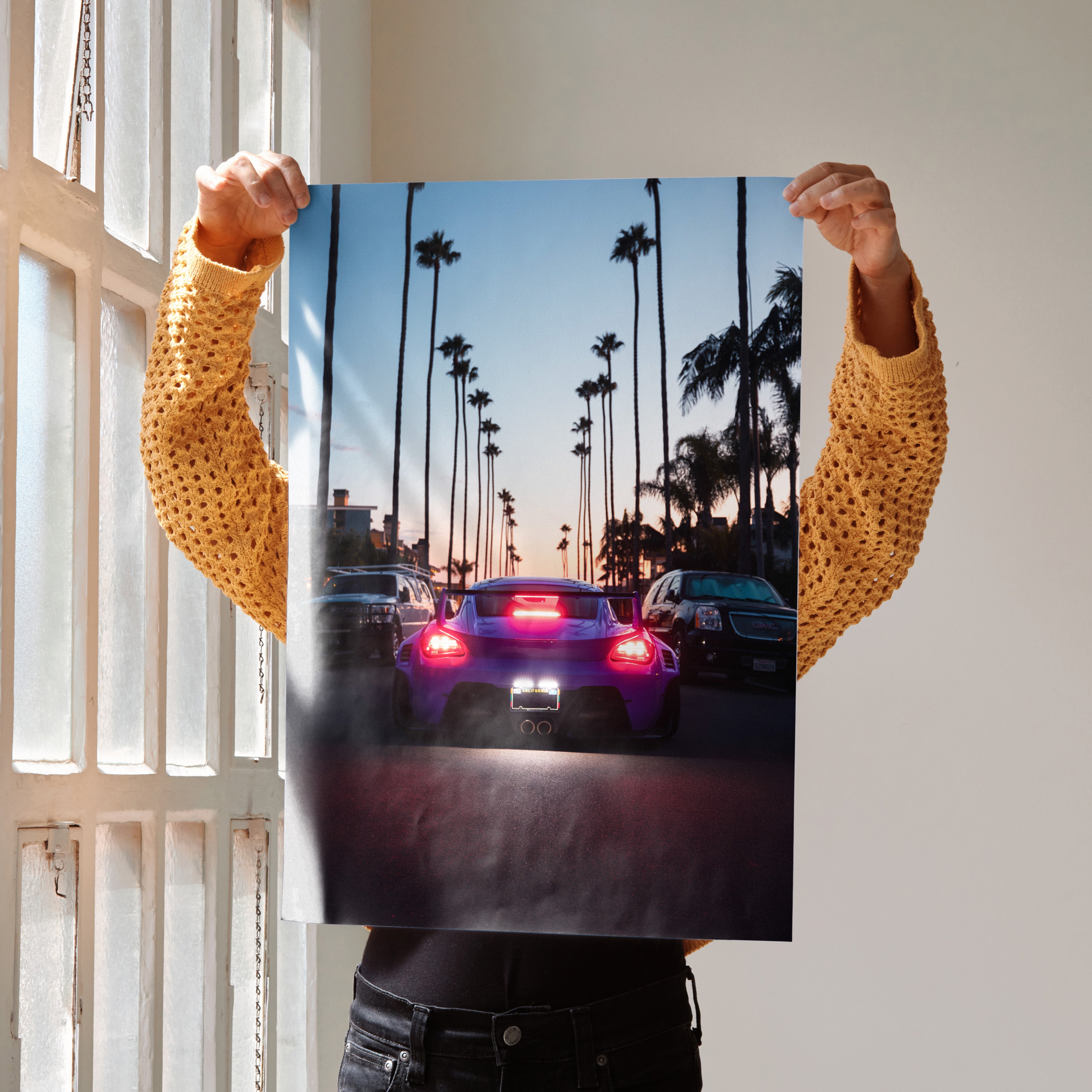 Porsche Cayman car poster showing rear view with palm trees at sunset, perfect wall art.