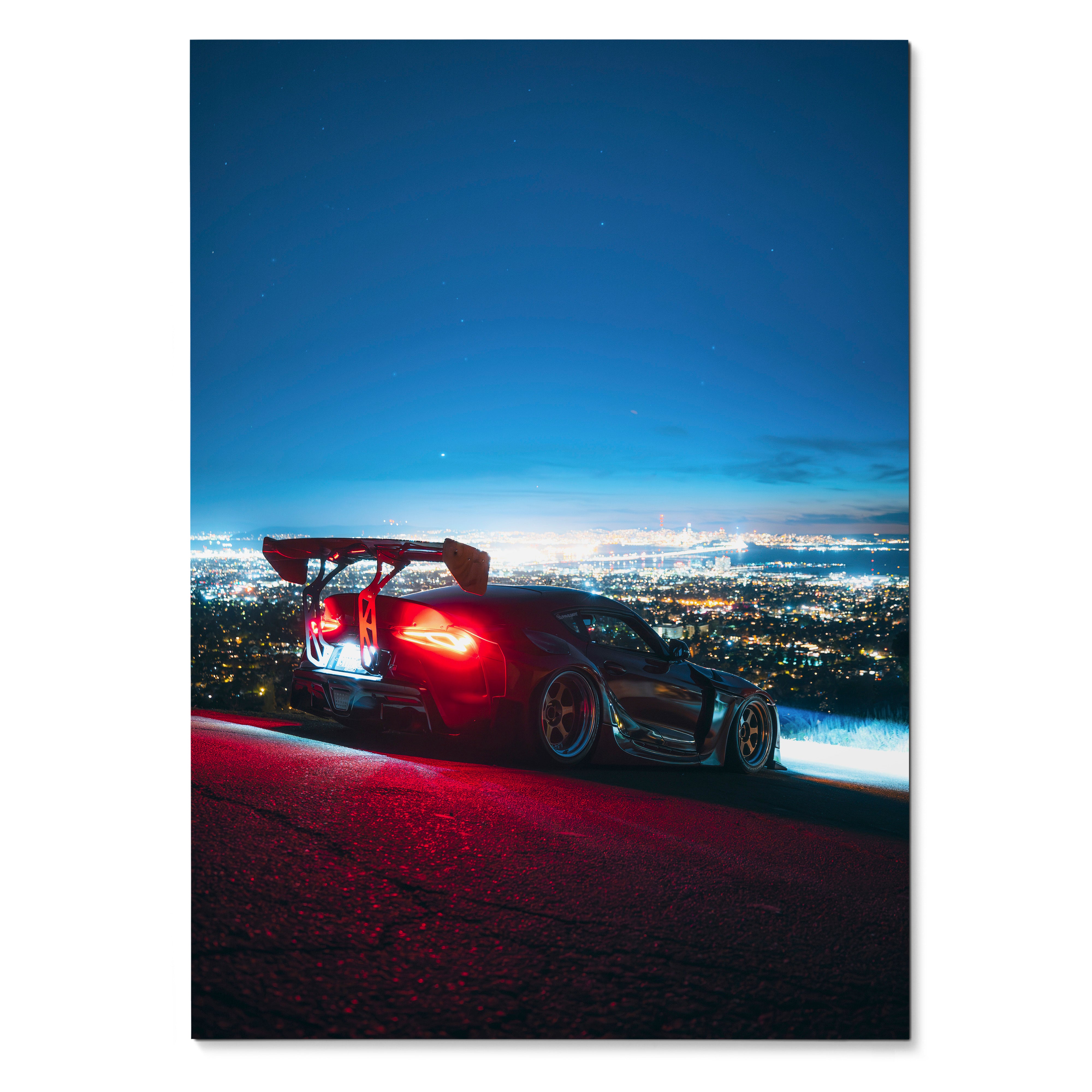 Toyota Supra Mk5 with rear spoiler at night overlooking city lights poster wall art.
