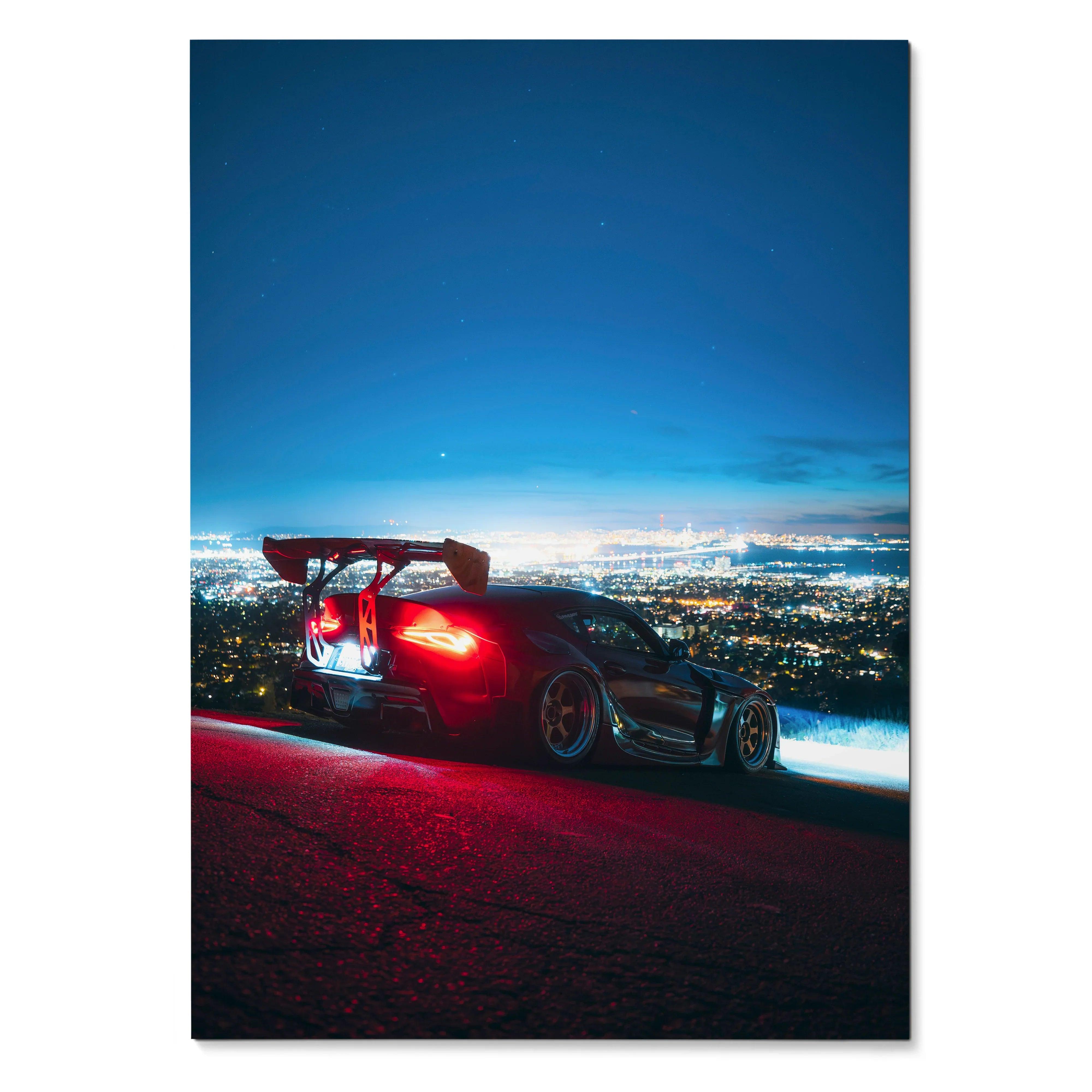 Toyota Supra Mk5 with rear spoiler at night overlooking city lights poster wall art.