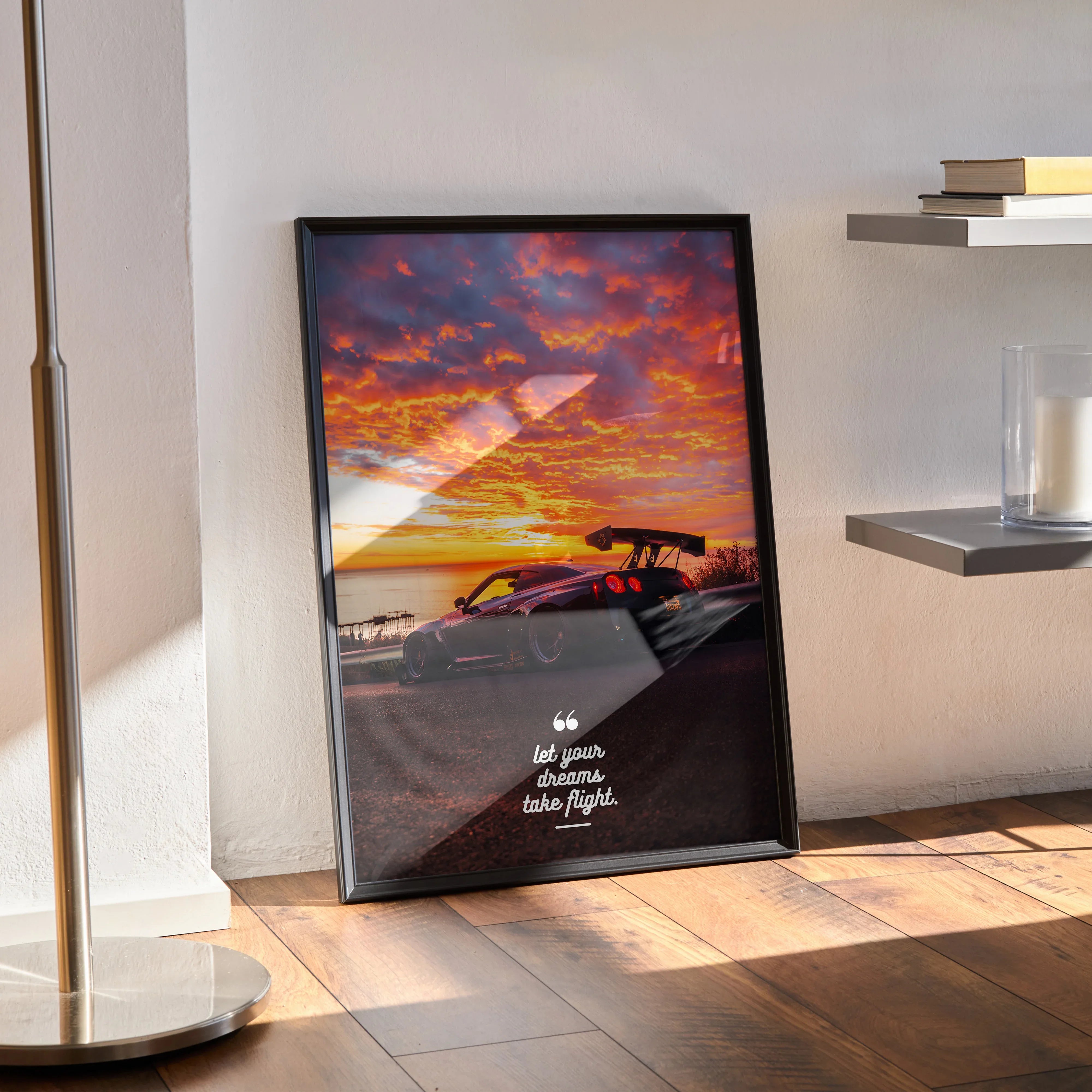 Poster wall art featuring a Nissan R35 GT-R with a vibrant sunset sky and inspiring text in white script.