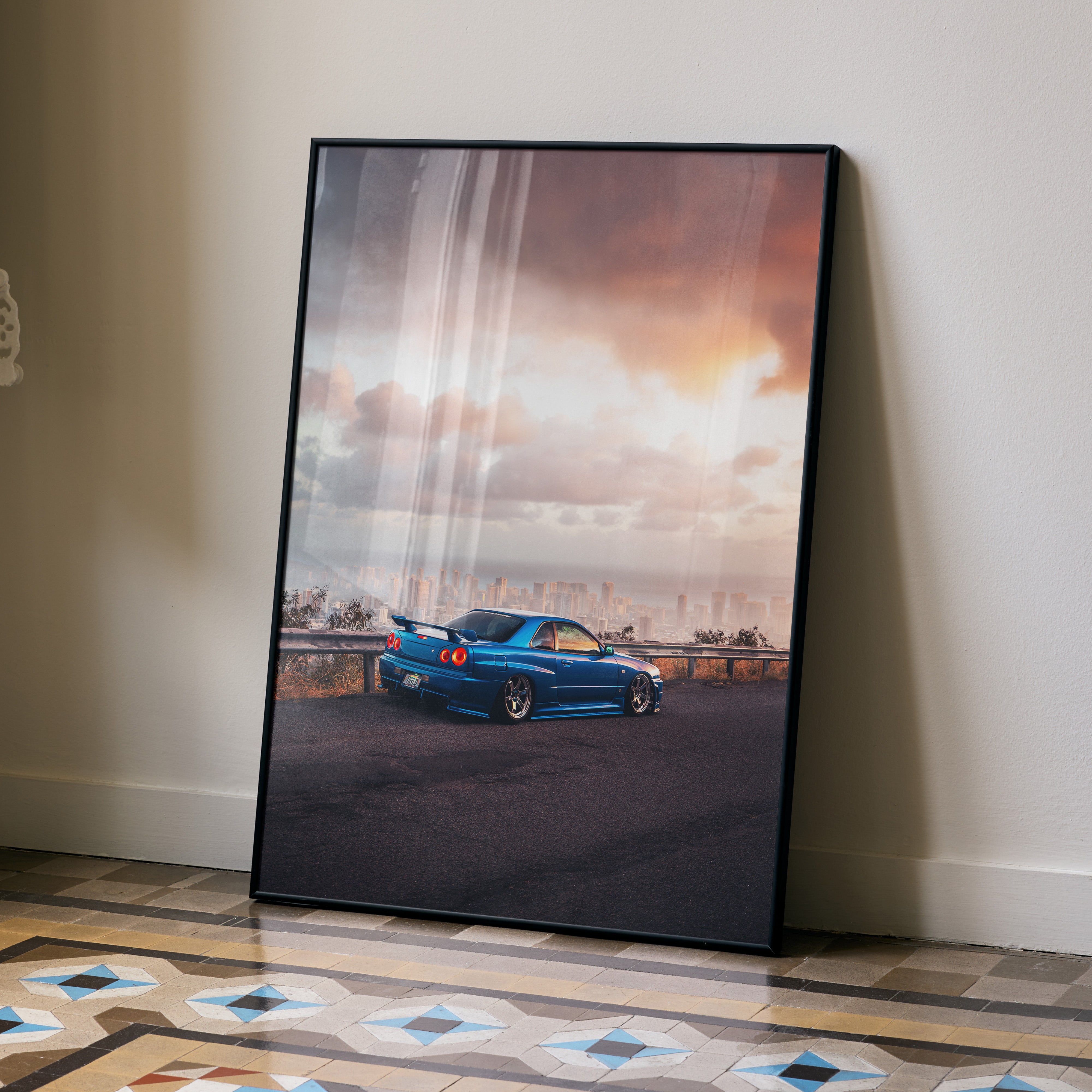 Nissan Skyline GTR R34 JDM poster in black frame, vibrant sunset background, automotive wall art.