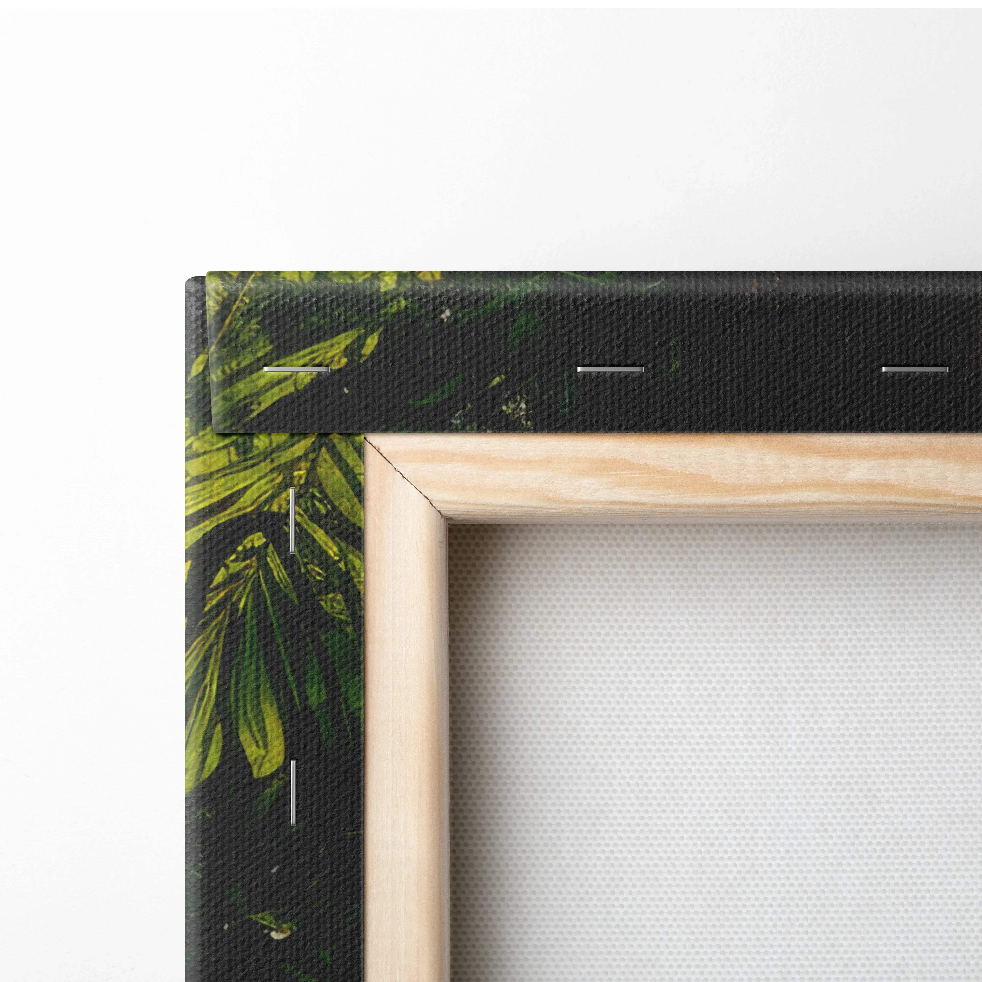Light-colored wooden frame canvas wall art featuring dark green and vibrant yellow-green tropical leaf pattern