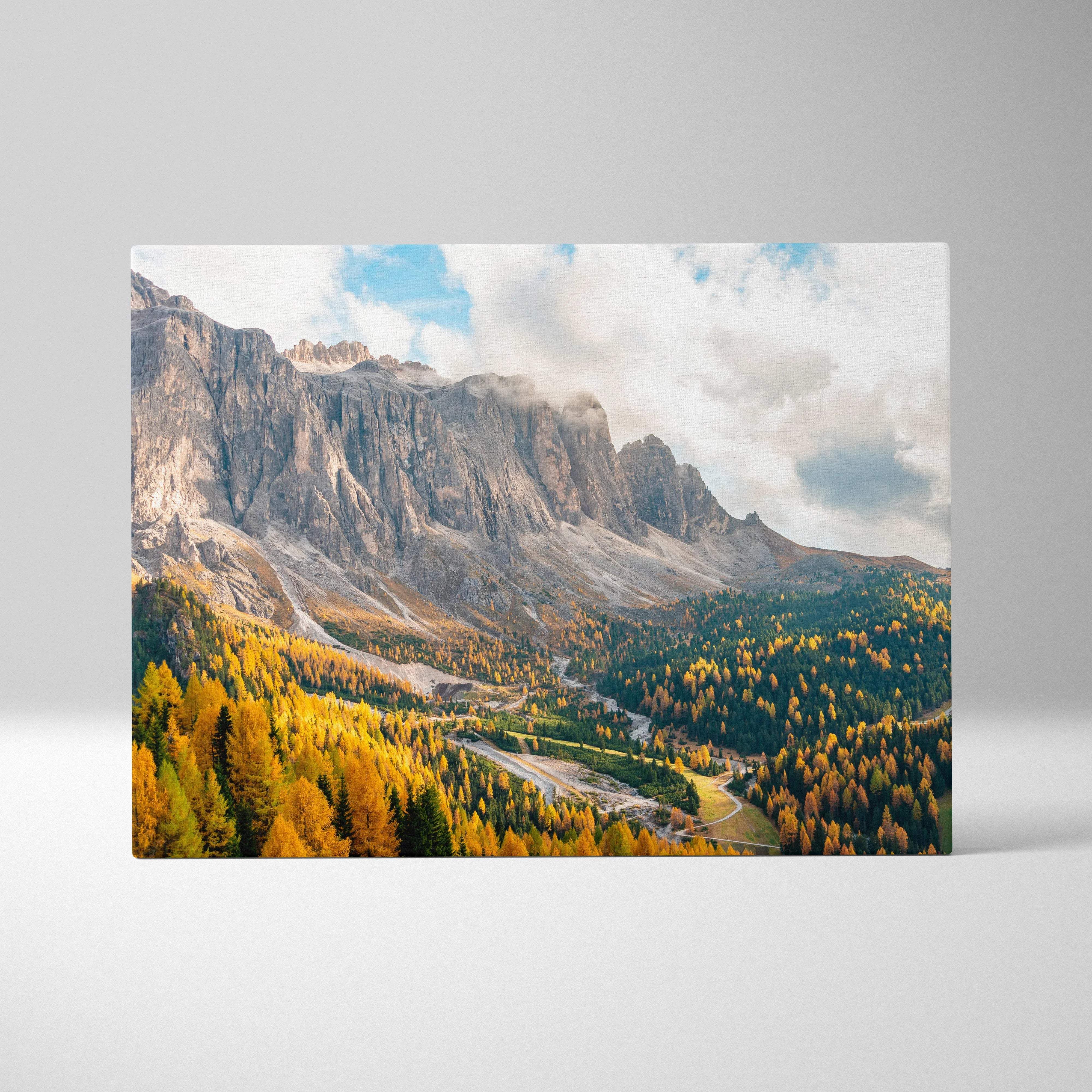 Canvas print of Dramatic Dolomites mountains with autumn forests at golden hour