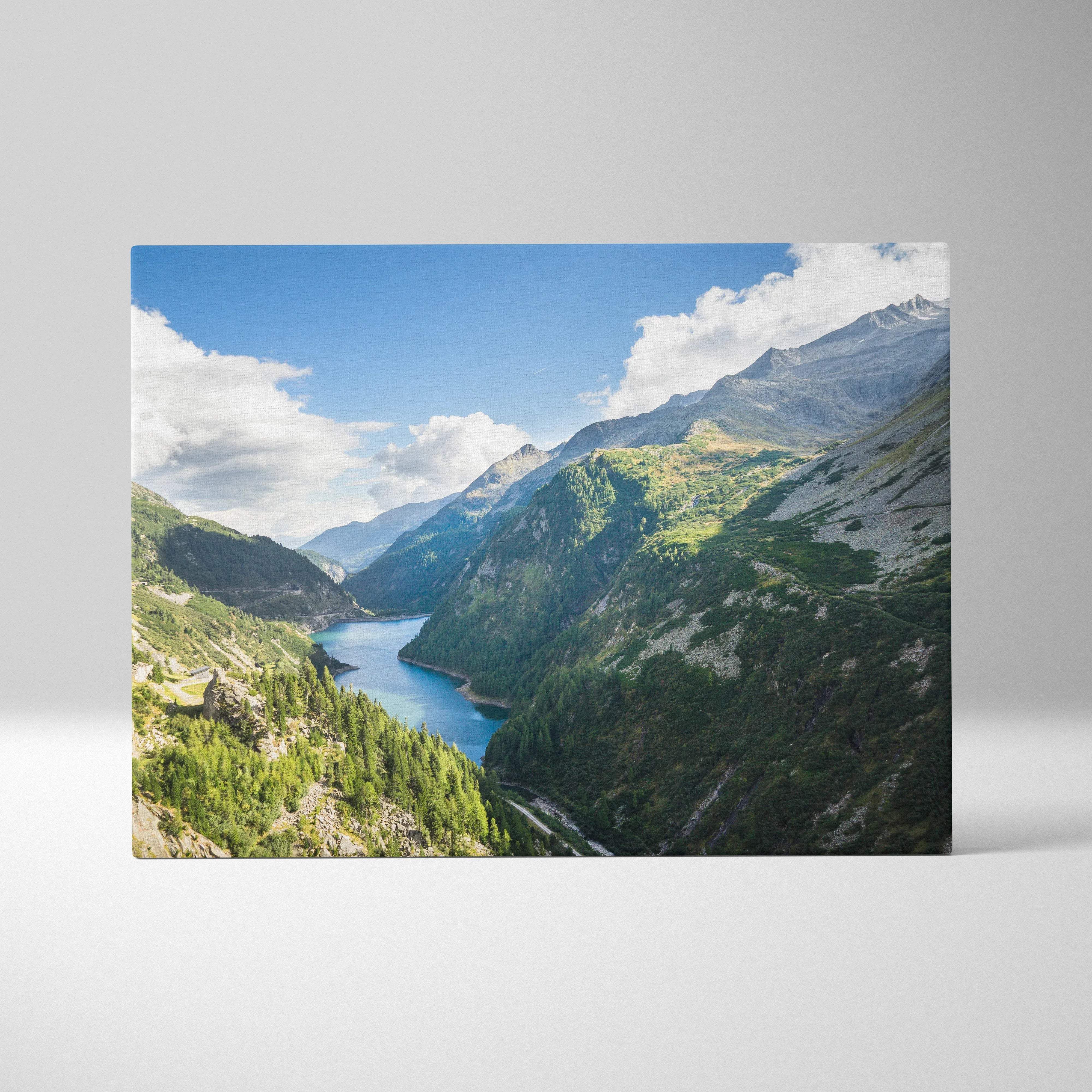 Vibrant canvas wall art of calm lake between mountains, lush valleys, blue sky