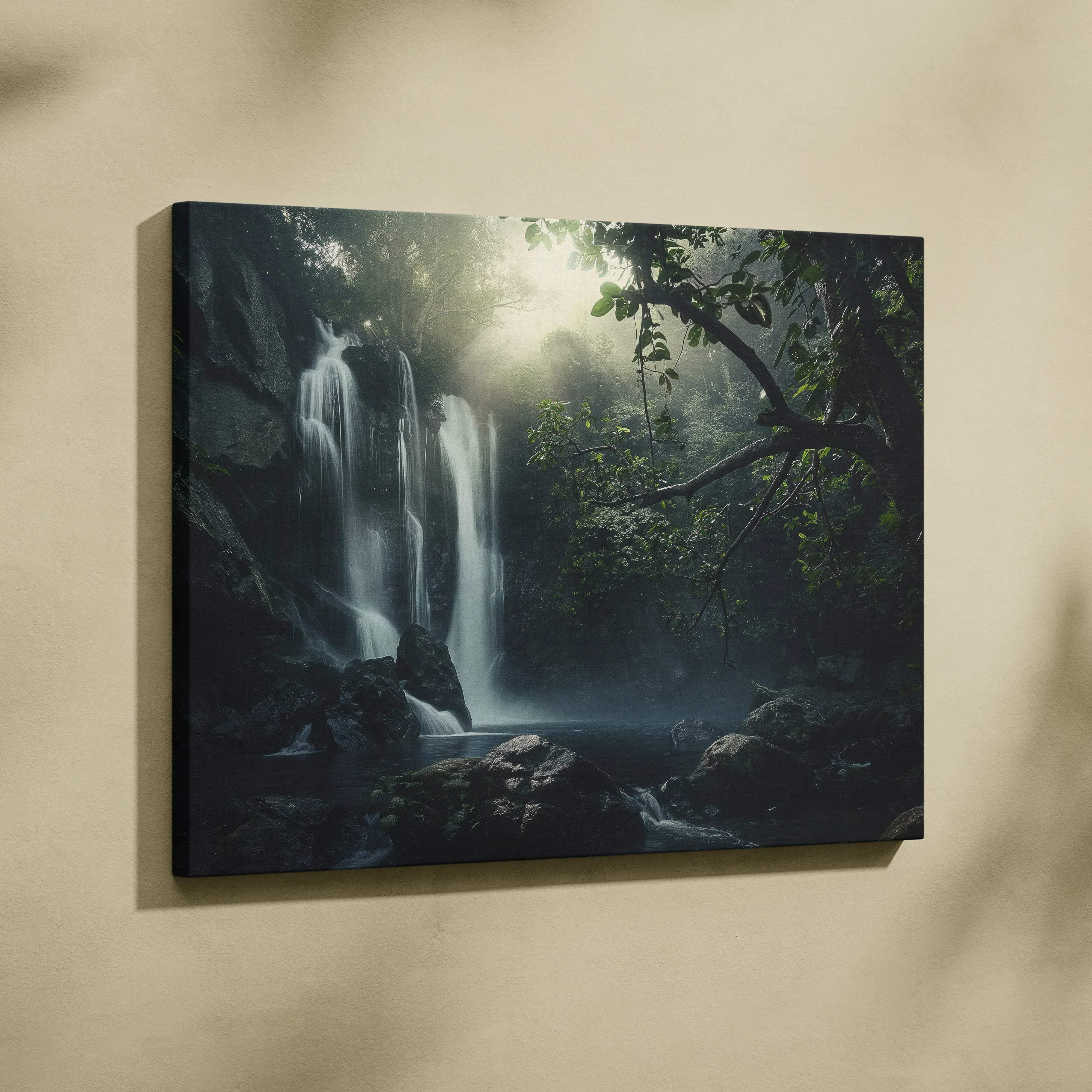 Black-framed canvas print of a misty waterfall cascading through dense green forest with sunlight piercing the canopy
