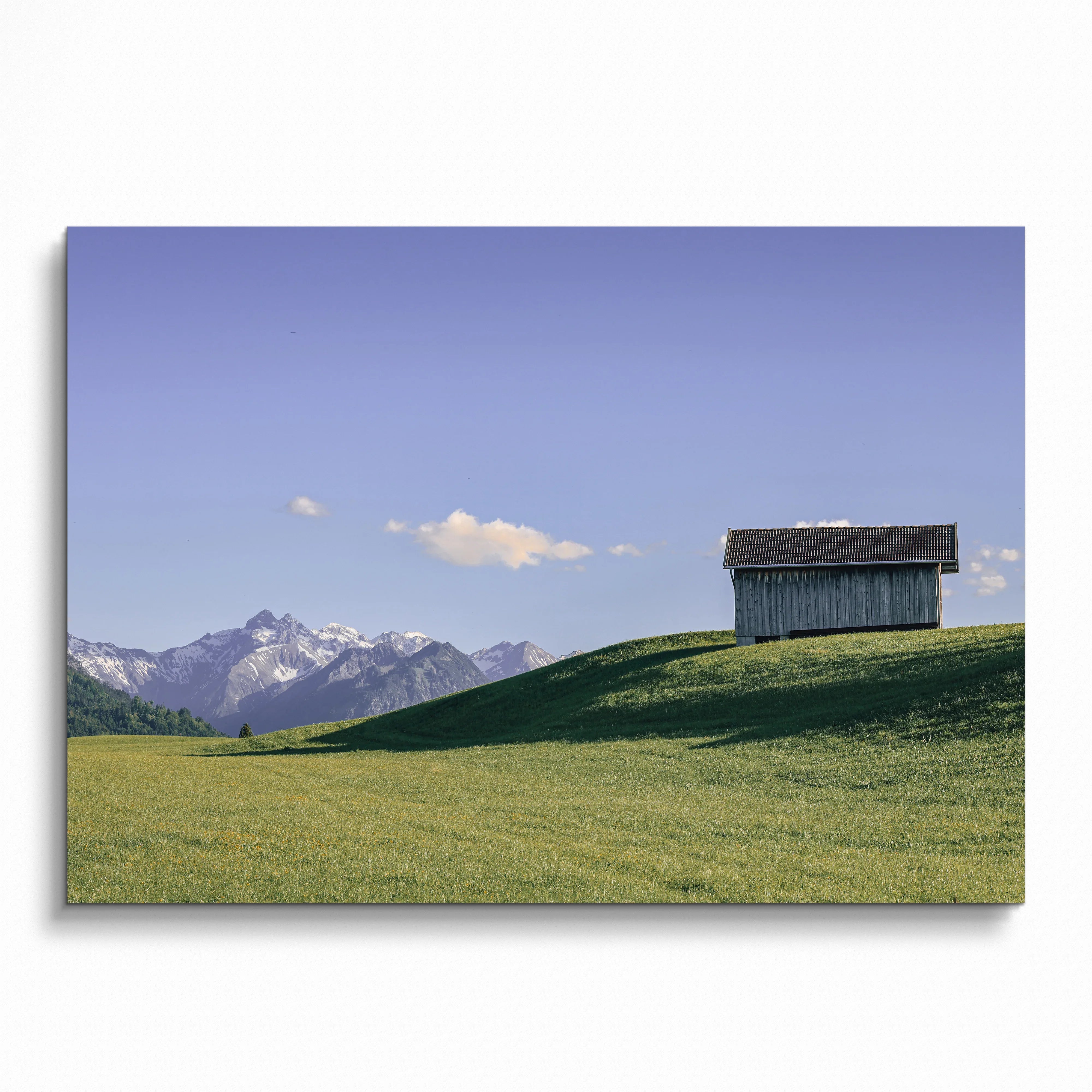 Majestic mountain landscape with green hill and wooden barn poster wall art.