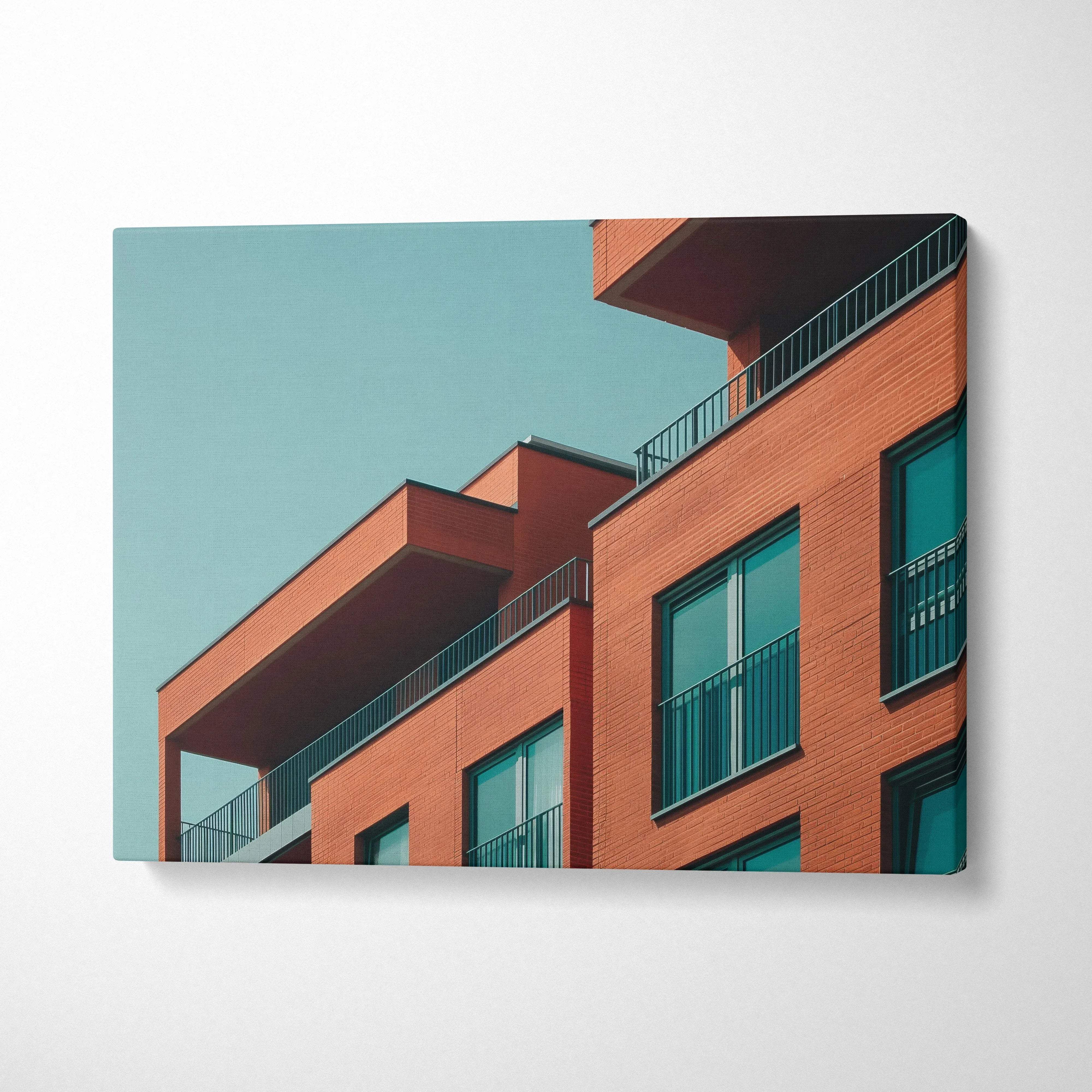 Modern architectural building with orange facade and blue windows on canvas wall art.