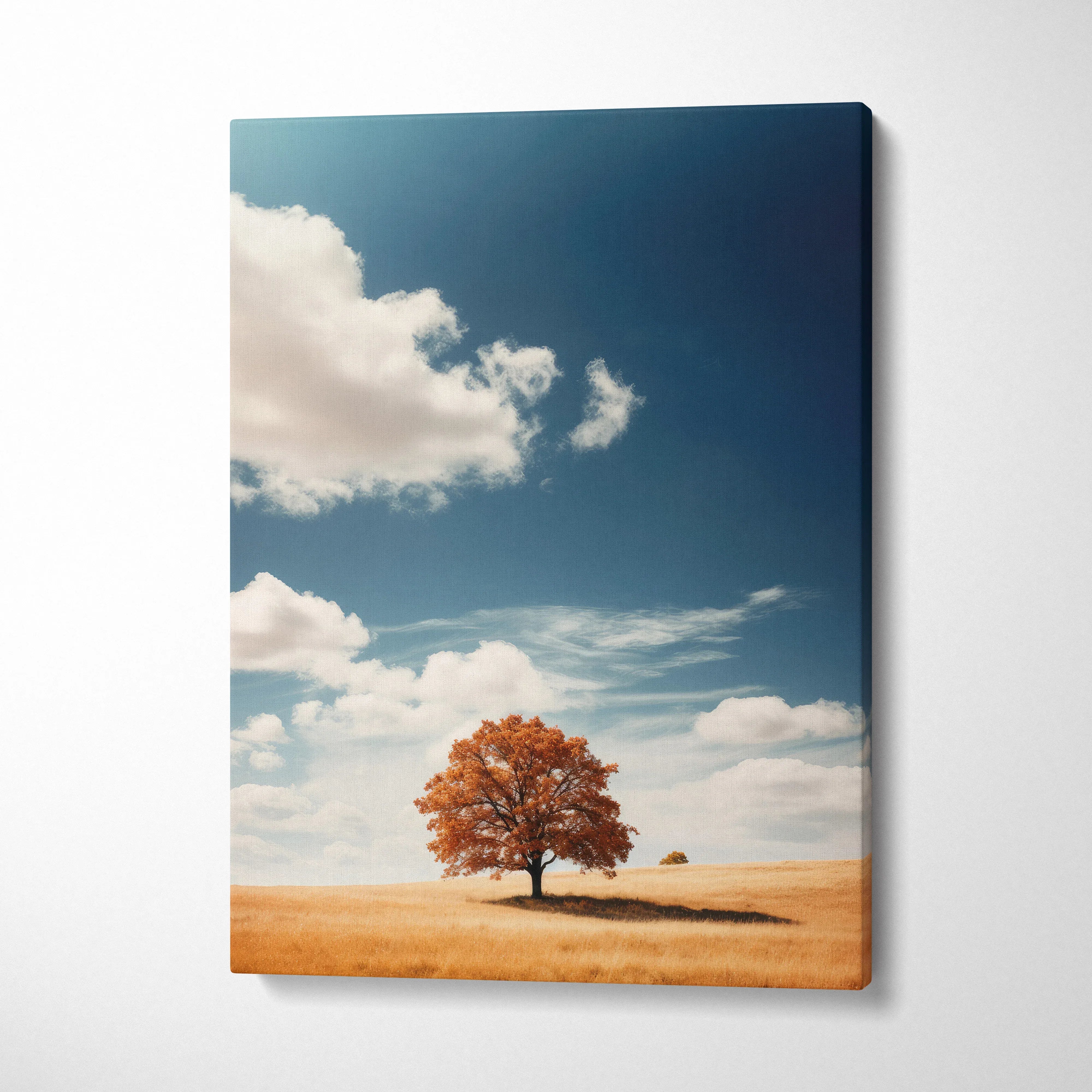 Vertical canvas wall art of a vibrant autumn tree in a golden field under a blue sky with clouds.