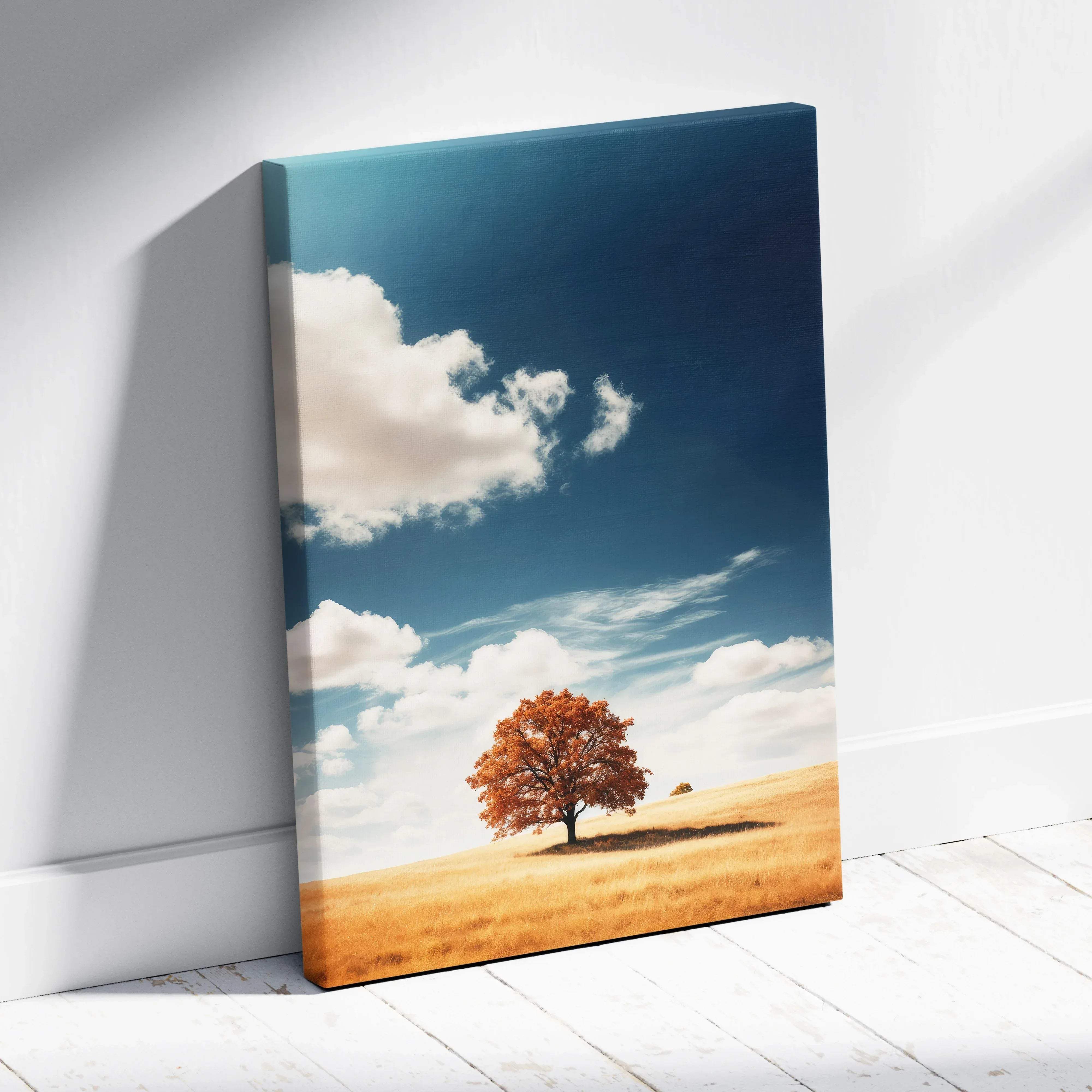 Autumn landscape canvas wall art with solitary orange tree in golden field under deep blue sky with white clouds