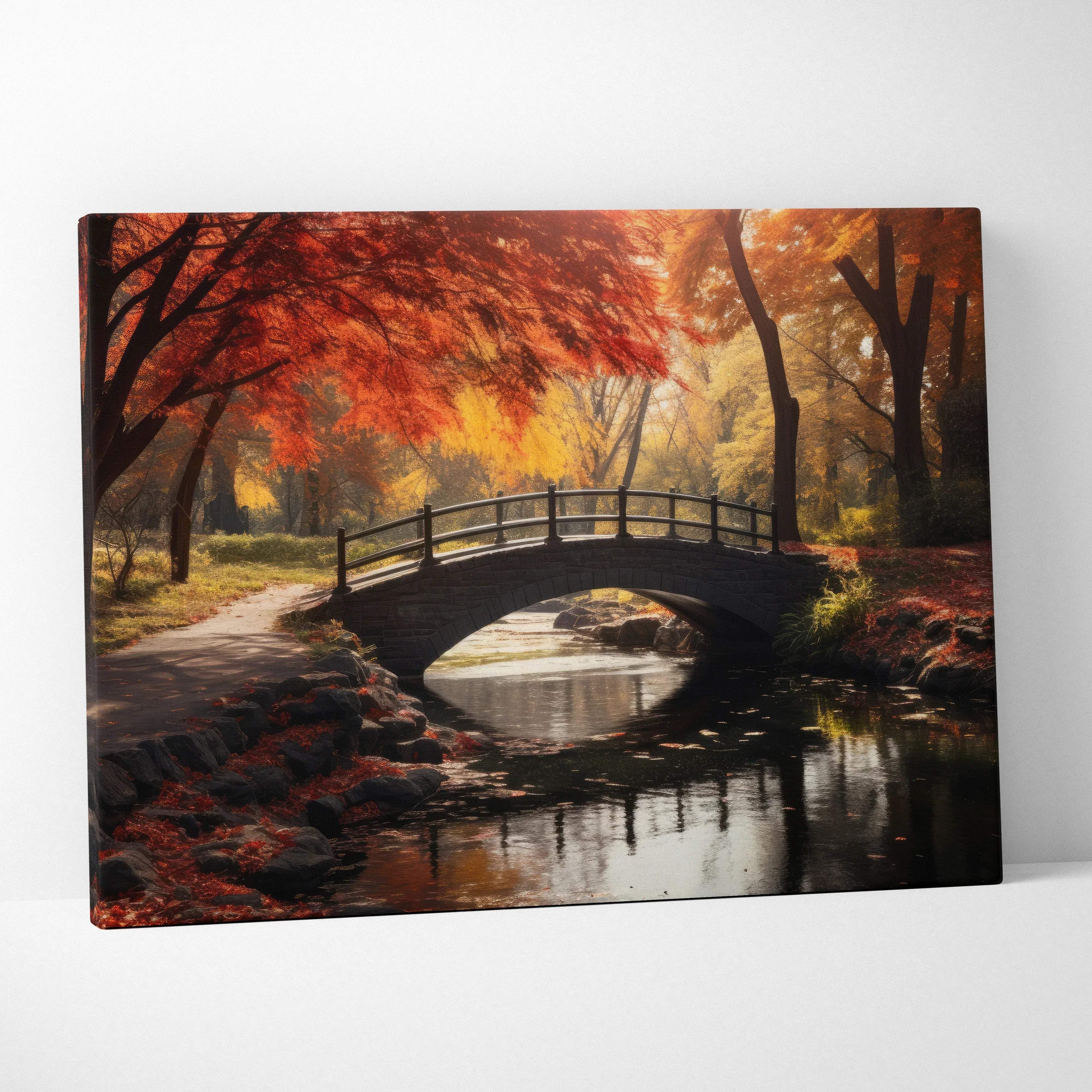 Autumn forest bridge over calm water canvas wall art featuring a stone arch bridge with fiery red and golden fall foliage