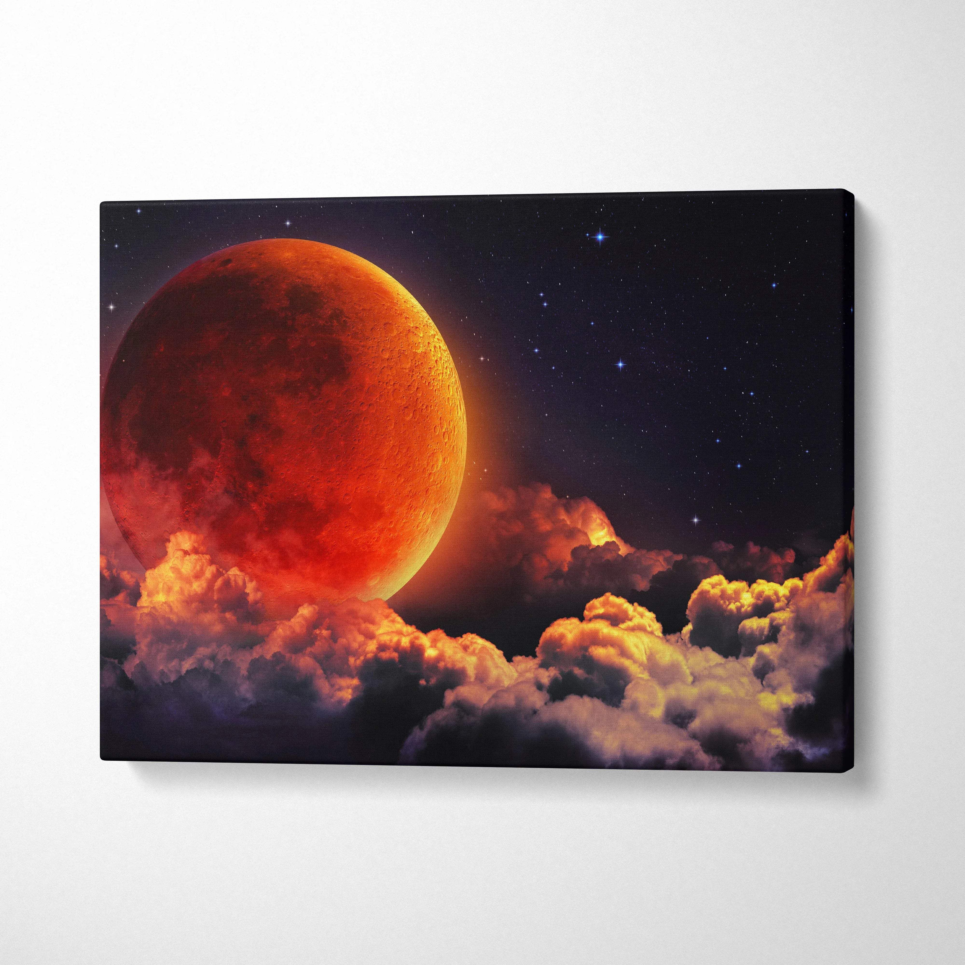 Massive red moon rising over glowing clouds in starry night sky canvas art