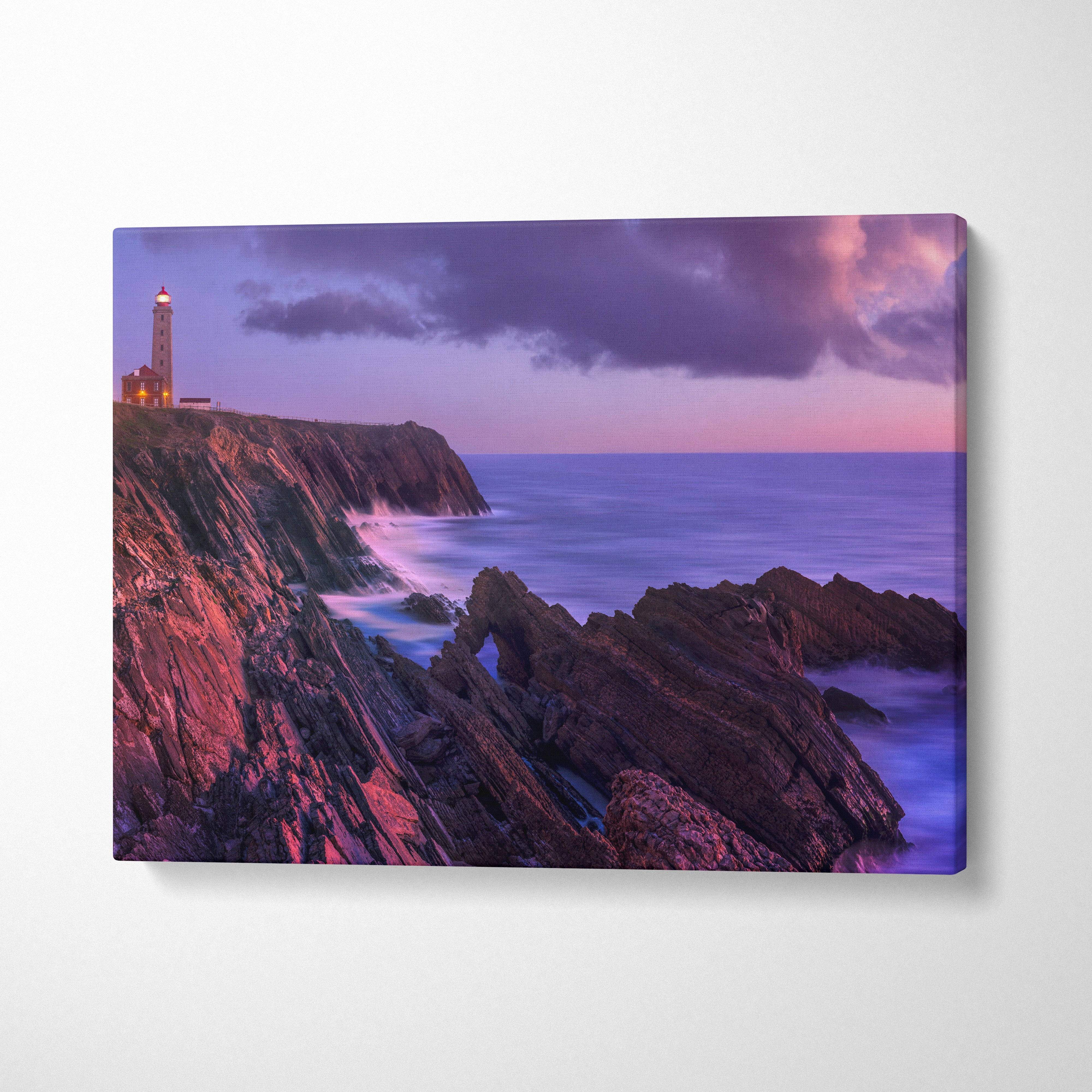 Canvas wall art featuring a tranquil beach sunset with rugged cliffs and lighthouse.