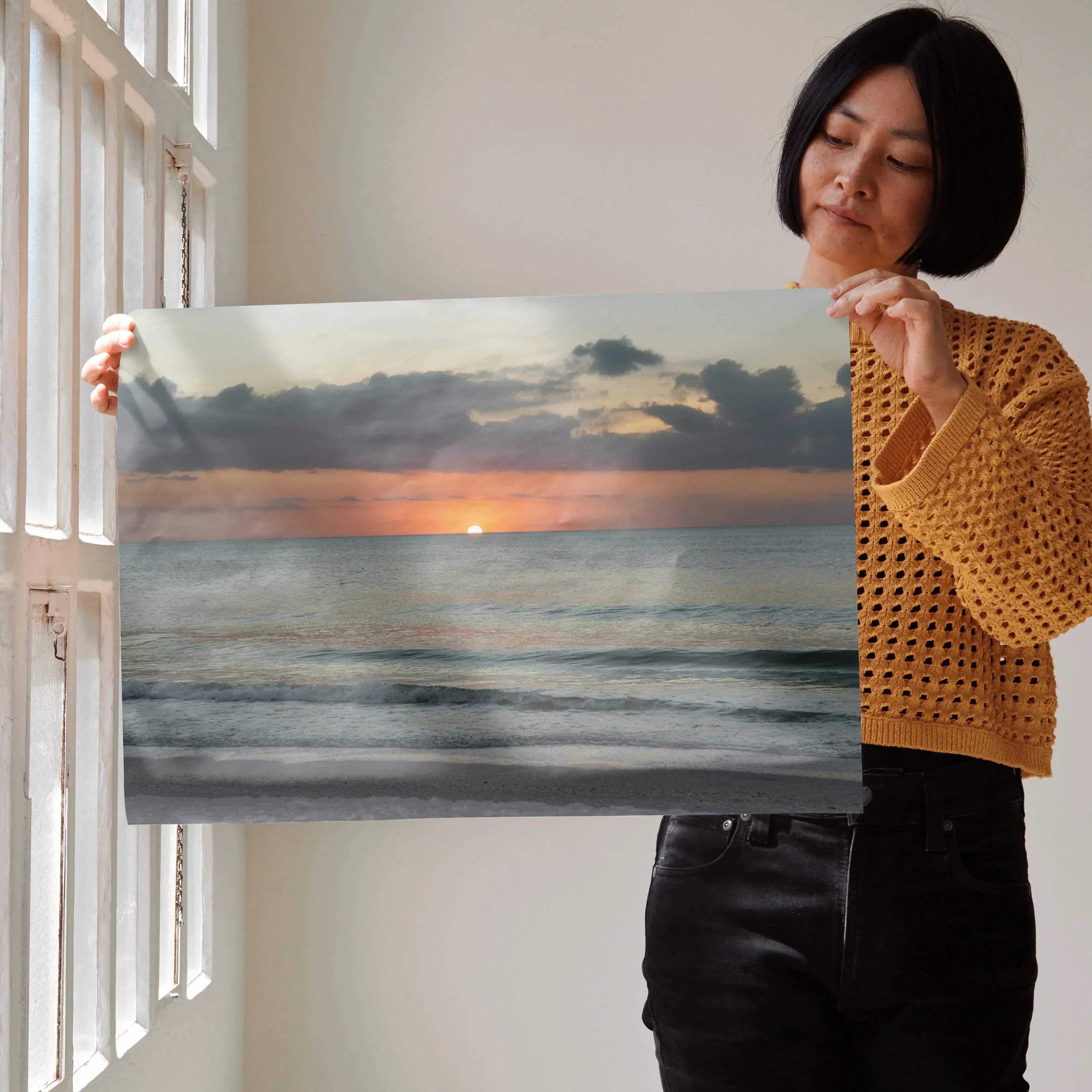 A rectangular canvas print beach sunset nature art poster featuring a serene ocean sunset with soft orange and gray clouds