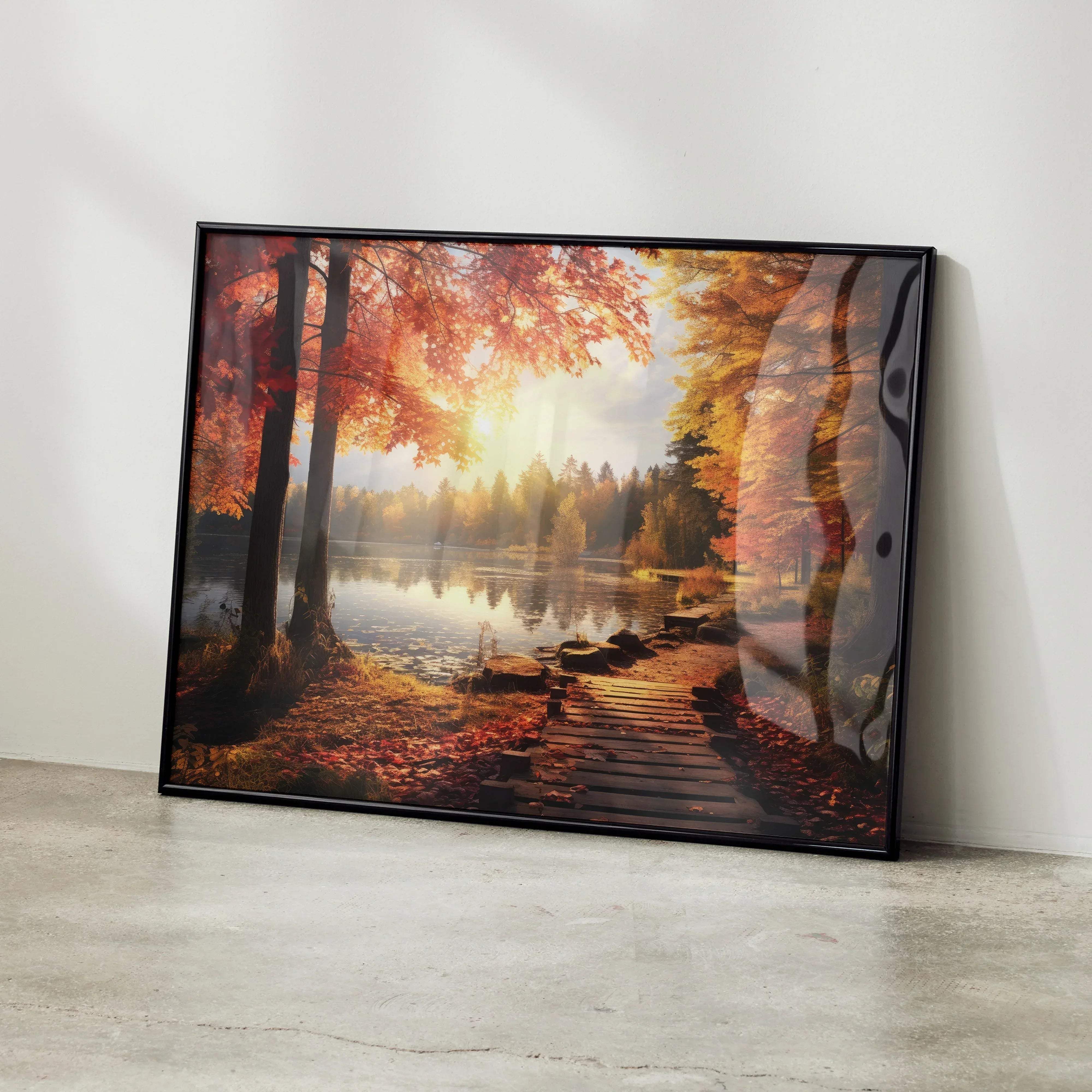 Black-framed canvas print of stunning autumn forest digital art with vibrant red foliage and wooden boardwalk by lake