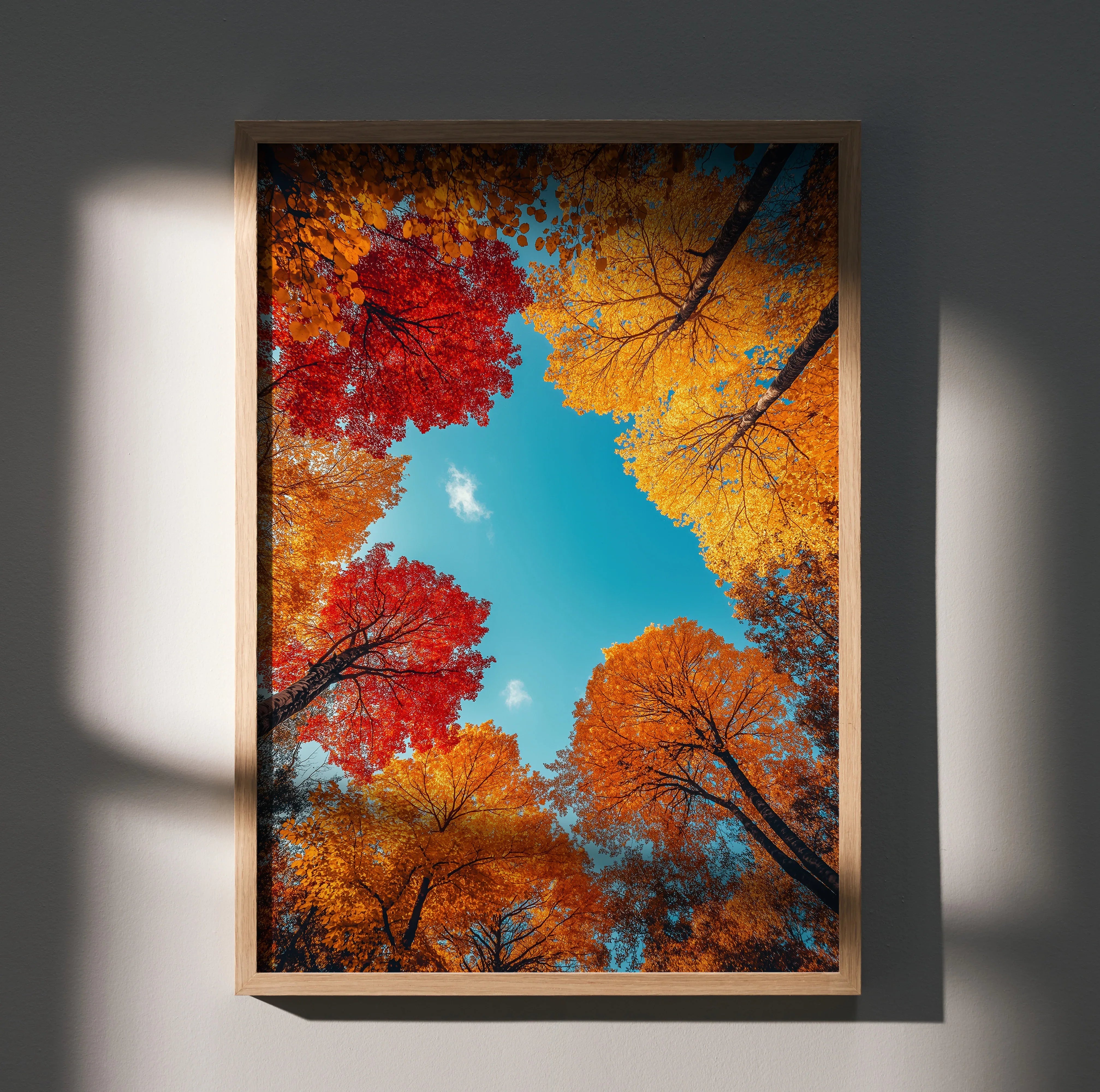 Vertical autumn forest poster with vibrant red, orange, and yellow leaves against blue sky wall art.