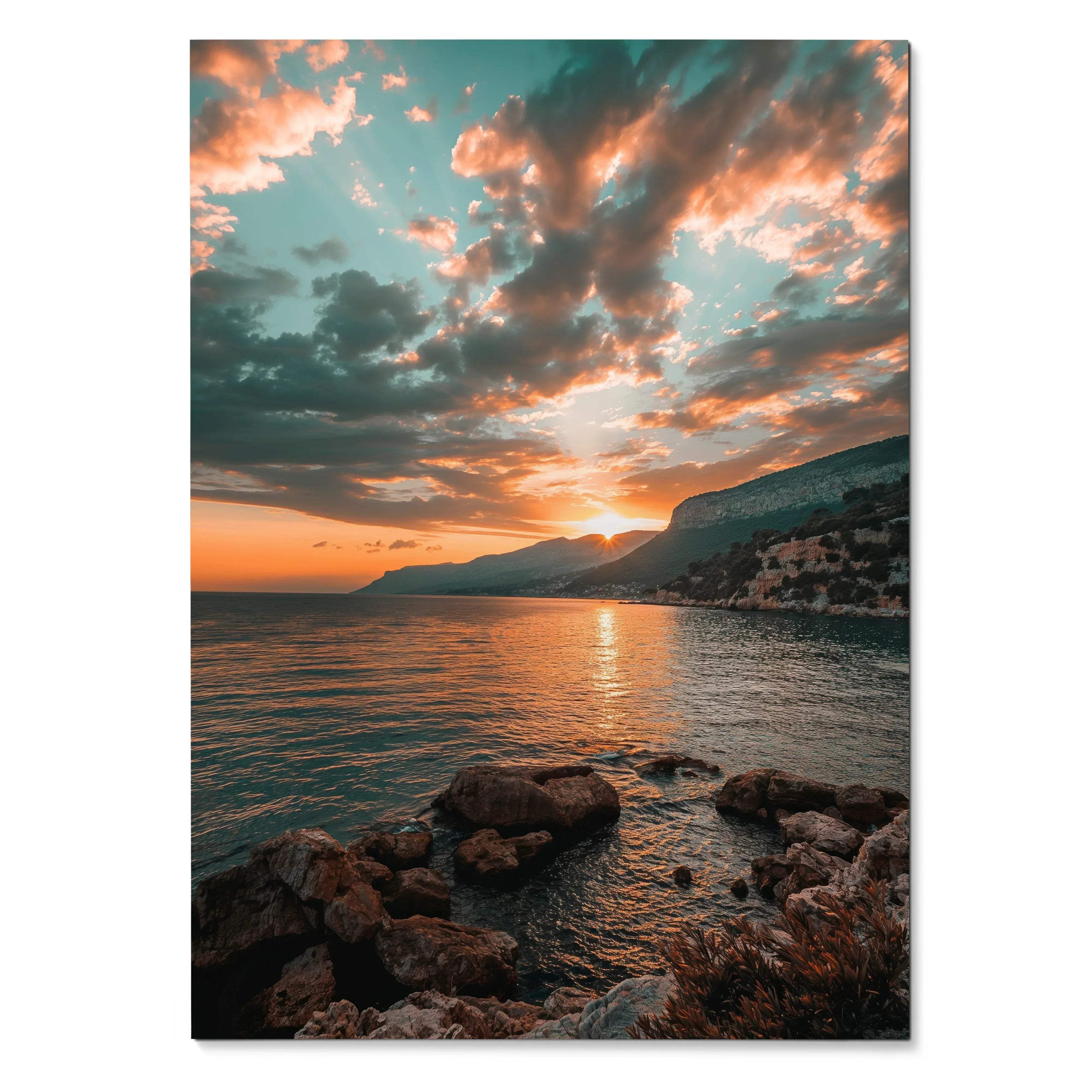 Sunset over rocky beach with clouds and ocean reflecting warm light poster wall art.