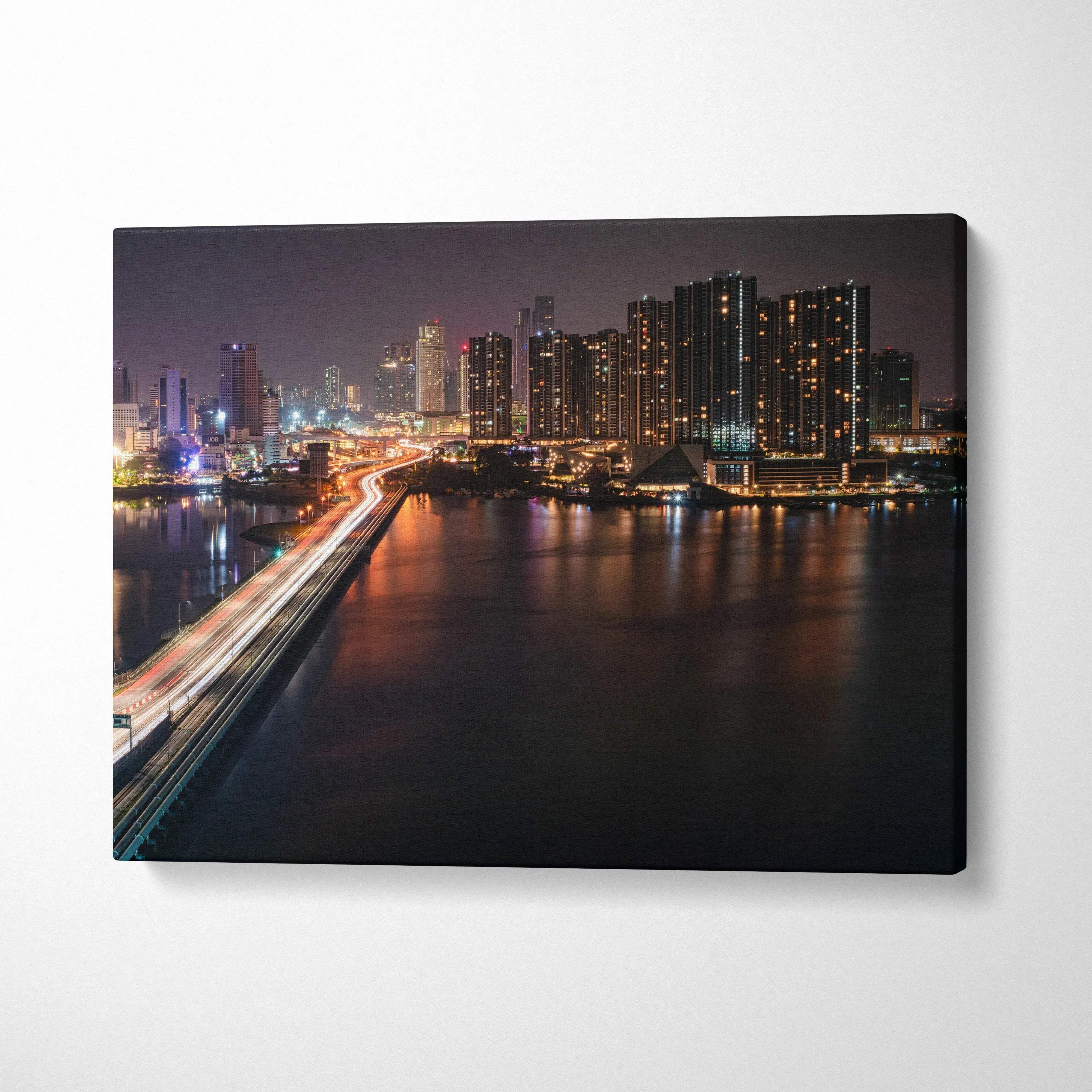 City skyline at night with illuminated buildings and light trails on a bridge on canvas wall art.