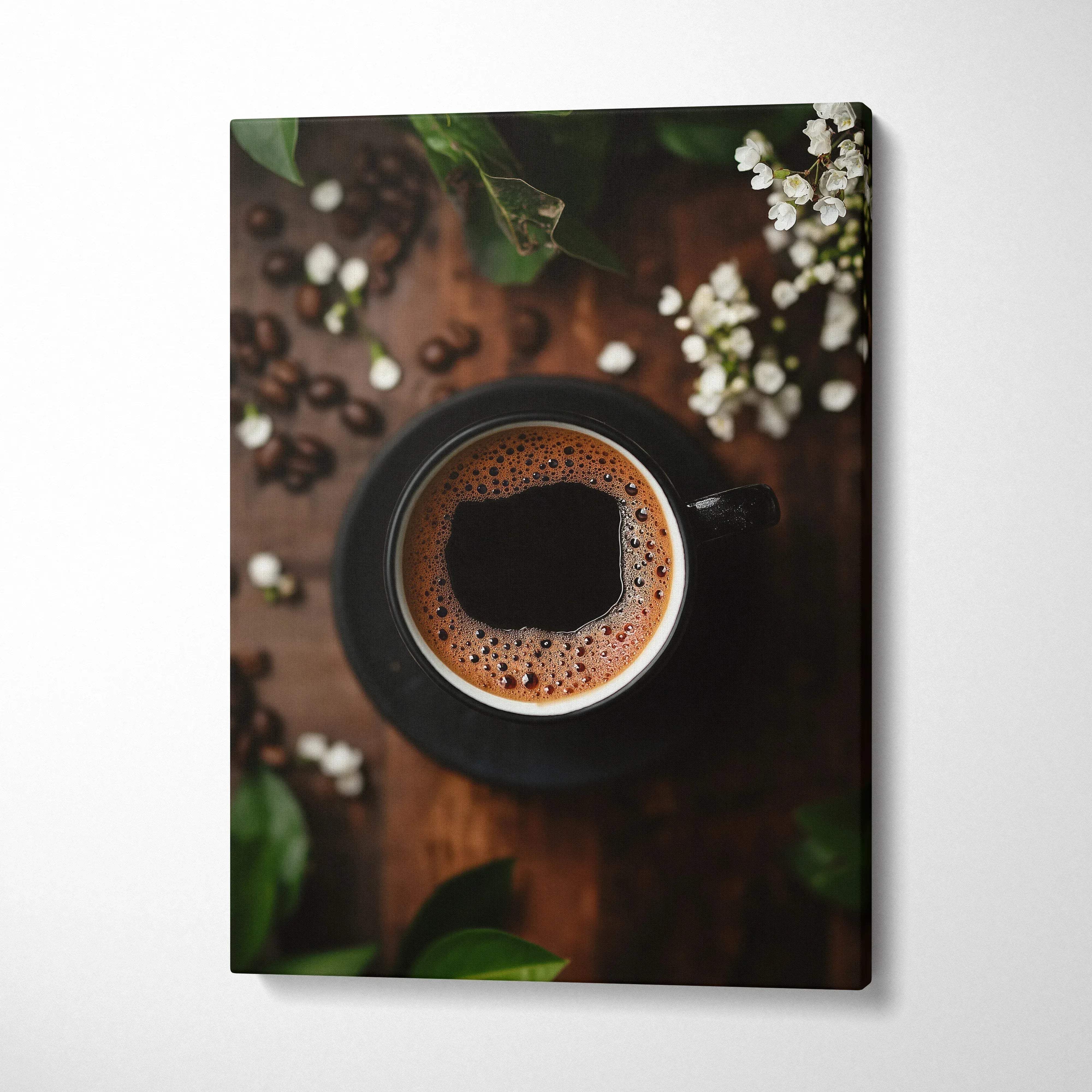 Vertical canvas wall art featuring a top-down view of a black coffee cup with frothy coffee on wooden table with coffee.