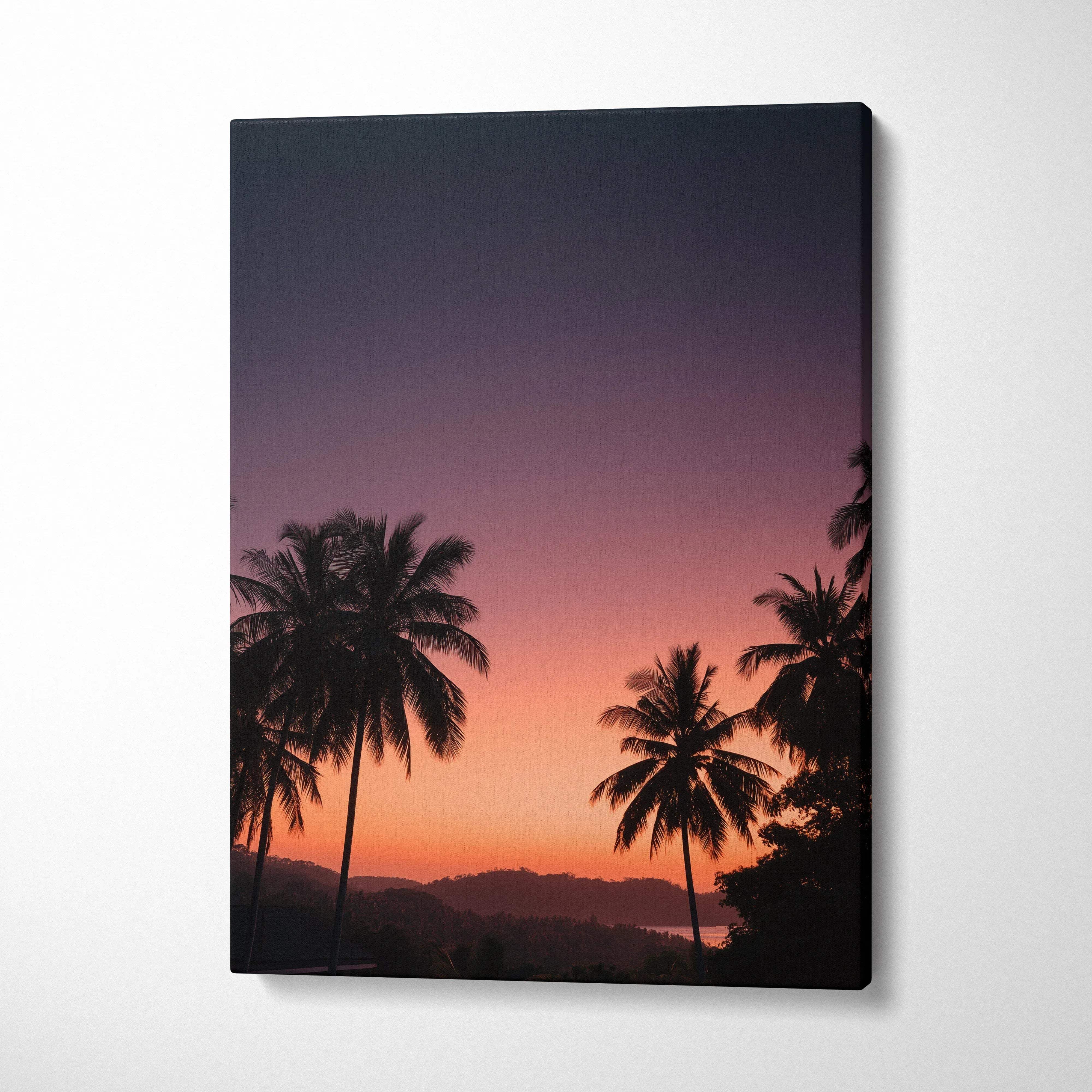 Vibrant sunset landscape canvas wall art with silhouetted palm trees and colorful sky.