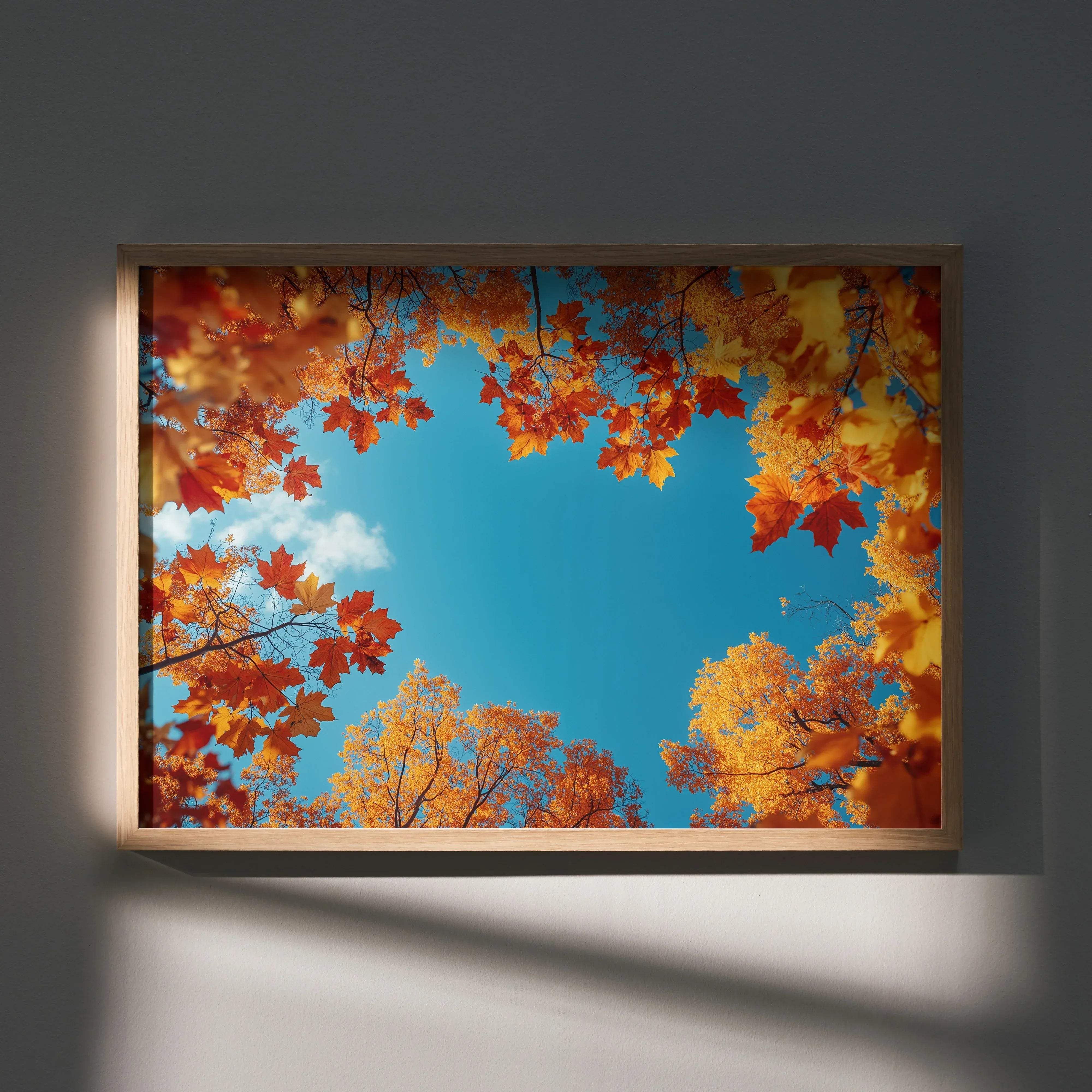 A rectangular framed autumn landscape digital art poster with vibrant orange and yellow maple leaves and bright blue sky