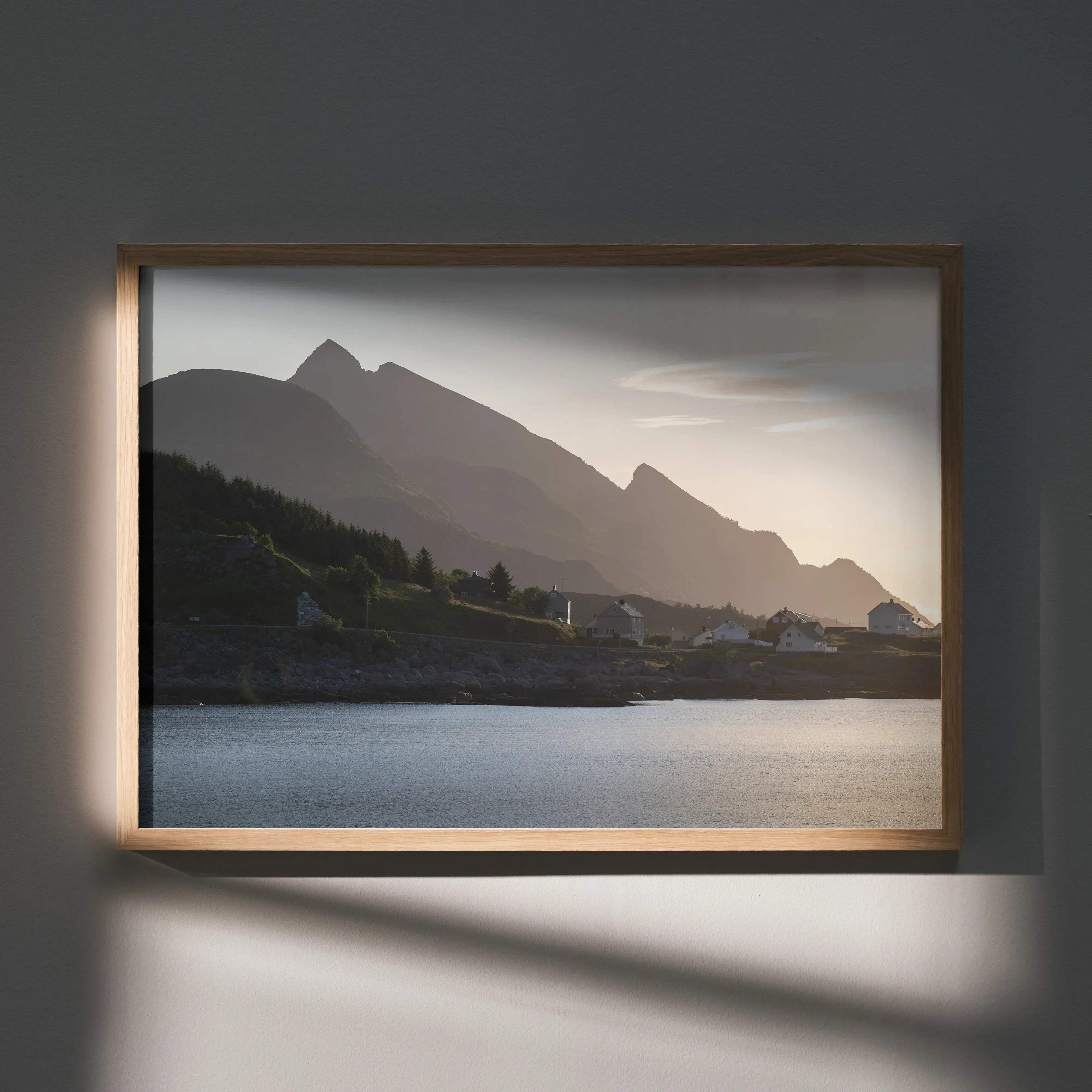 Stunning mountains and sunset art print poster with minimalist wooden frame showing silhouetted mountains and calm water