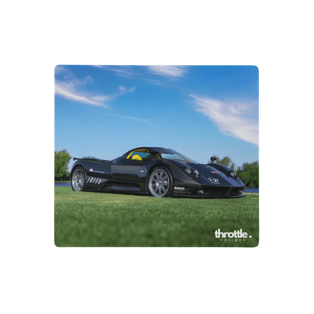 Black pagani zonda f gaming mouse pad featuring a sports car with yellow interior and silver alloy wheels