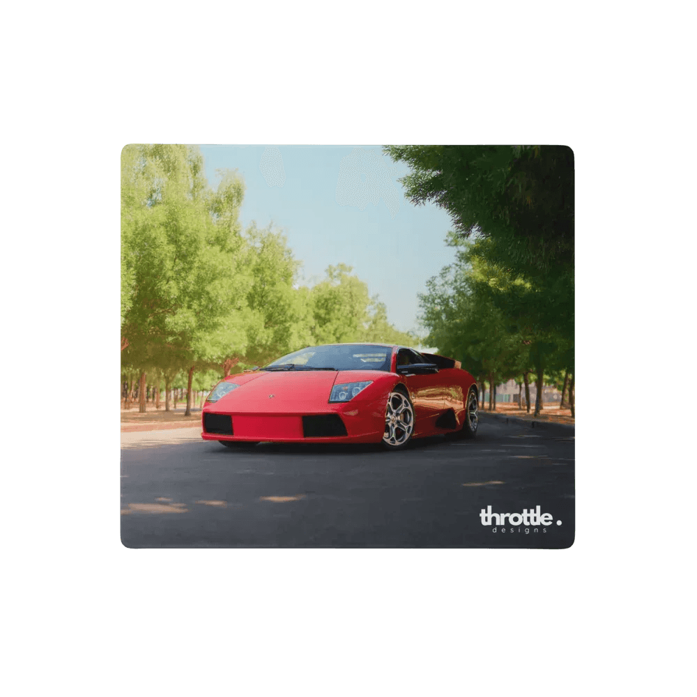 A vibrant red lamborghini murciélago roadster featured on a large gaming mouse pad with a sleek angular design