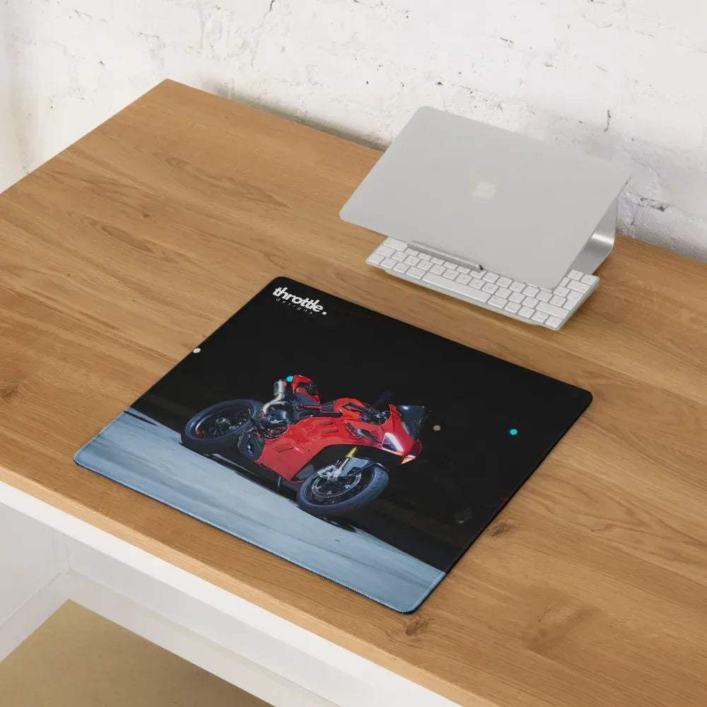 Black rectangular gaming mousepad featuring a red Ducati Panigale V4S motorcycle graphic with throttle brand logo