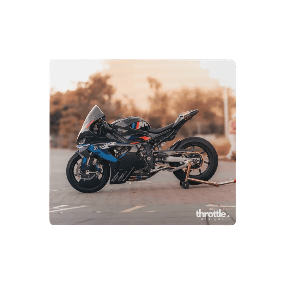 Bmw inspired m1000rr gaming mouse pad featuring a black and blue sport motorcycle with red accents and aerodynamic design