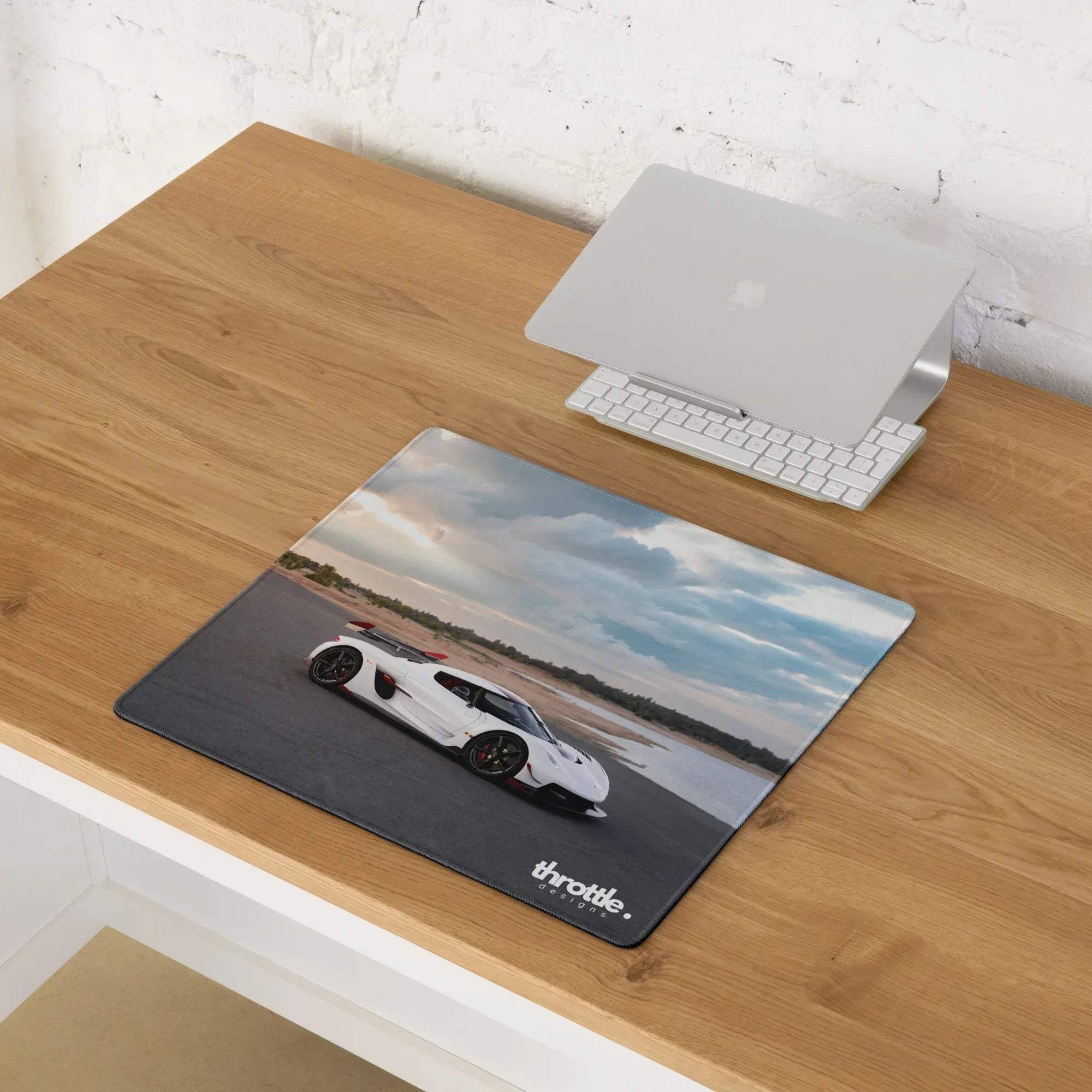 White koenigsegg jesko sports car graphic on black gaming mouse pad with throttle designs branding large xl extended size