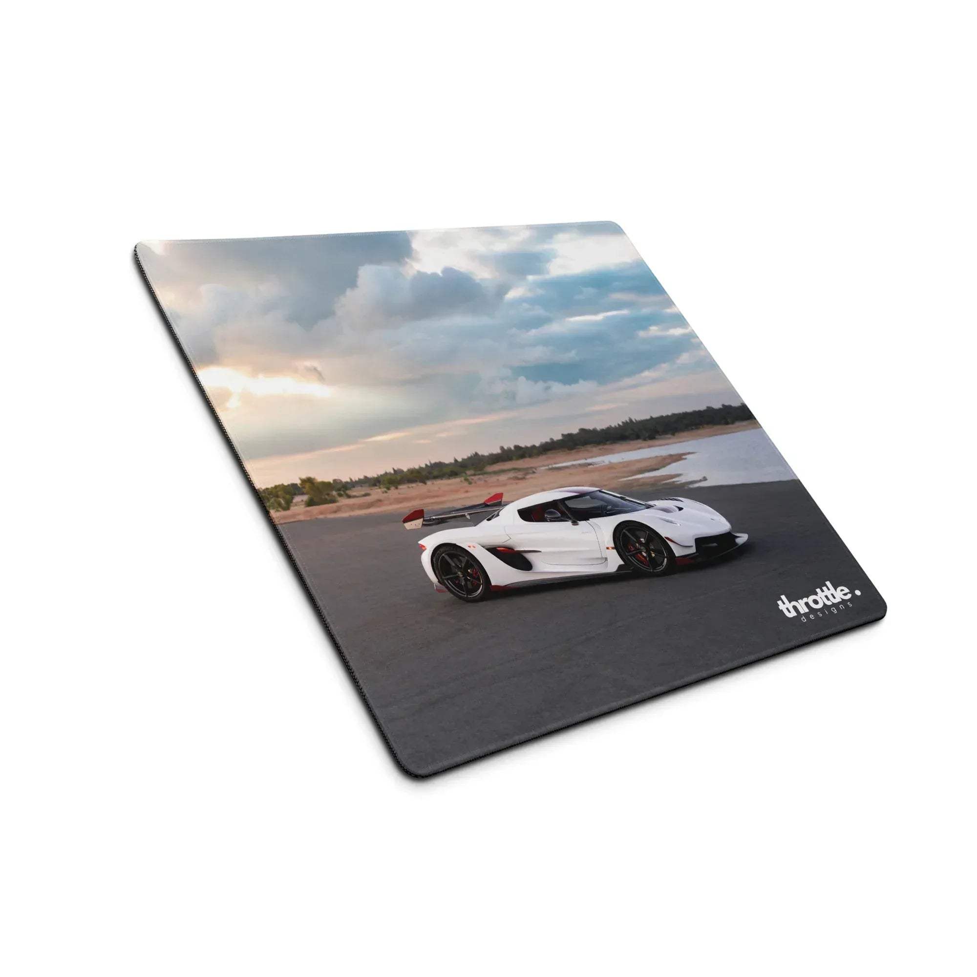 White koenigsegg jesko hypercar printed on a large rectangular gaming mousepad for extended desk use
