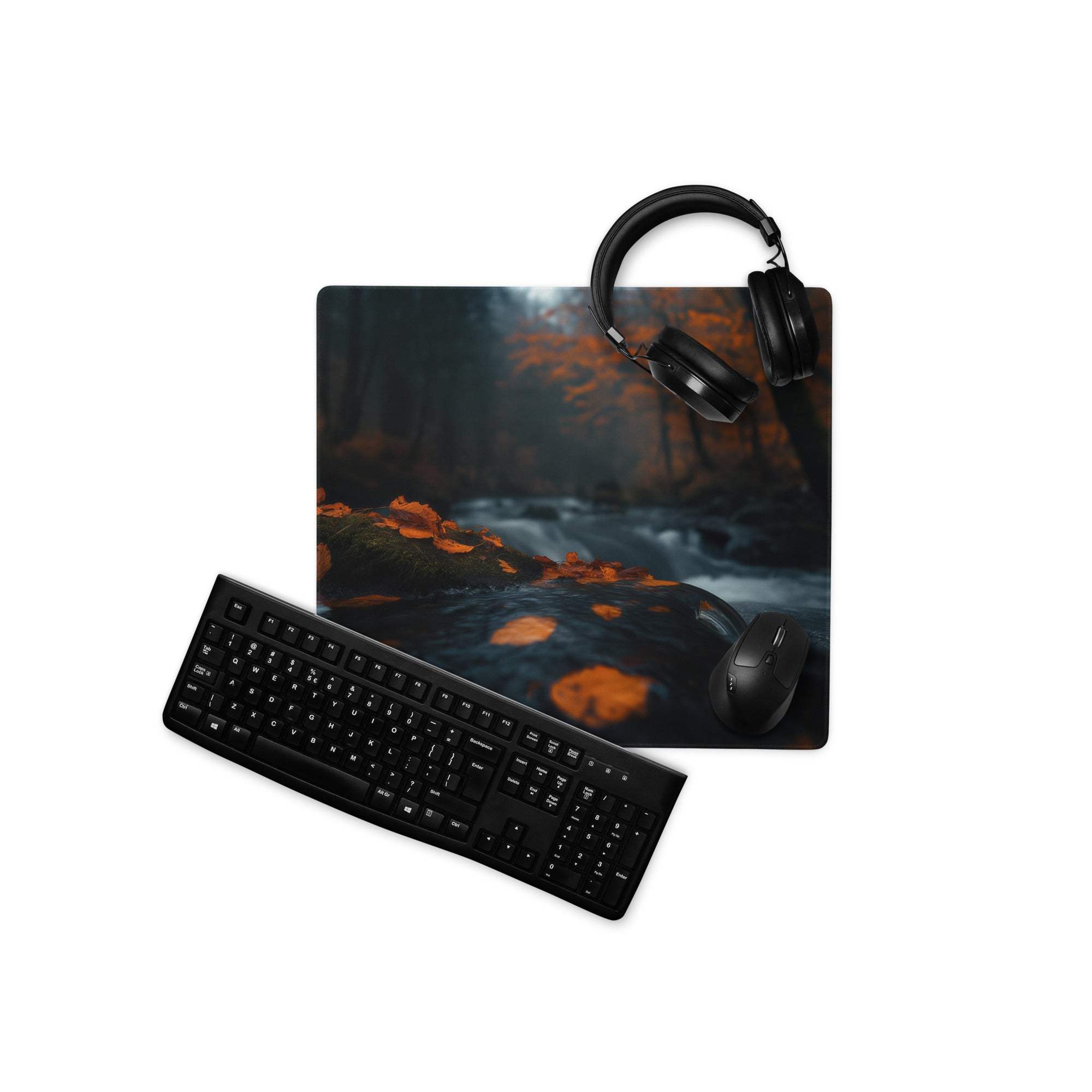 Black keyboard and mouse on Moody Forest Night gaming mousepad with autumn stream