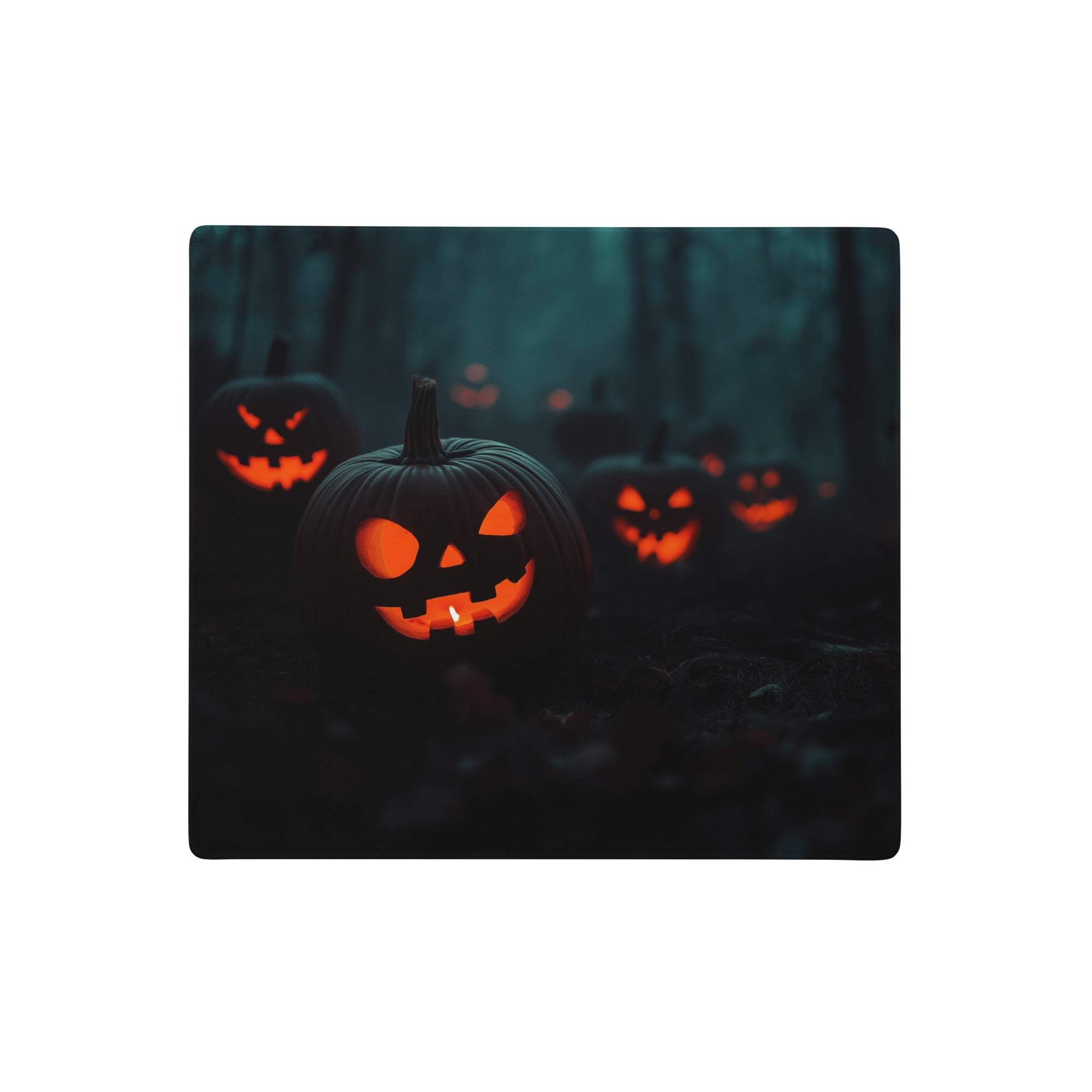 Moody halloween pumpkin gaming mouse pad with glowing orange carved pumpkins on dark forest backdrop for pro gaming