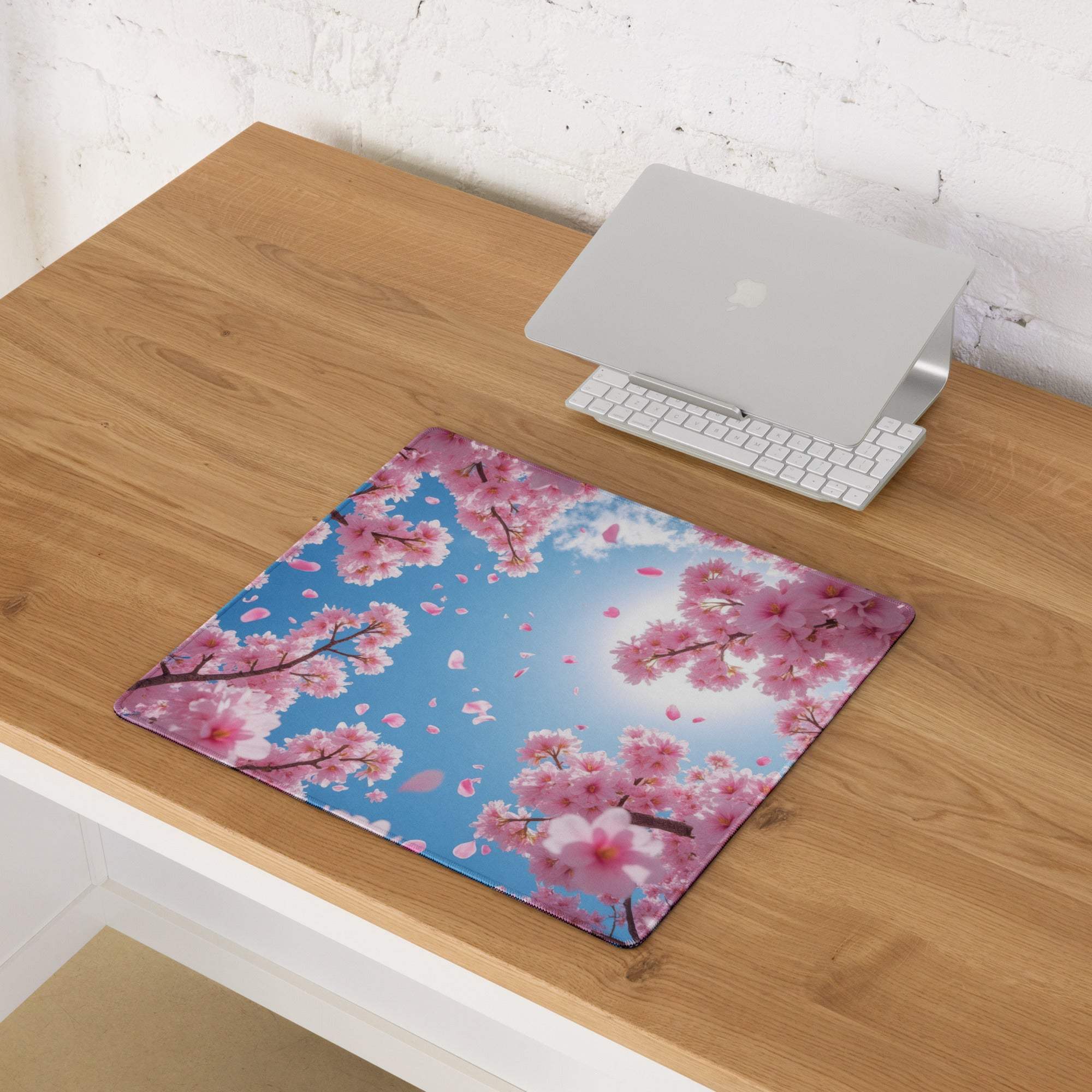 Rectangular cherry blossom mouse pad with vibrant pink flowers on blue sky for uplifting office or desk use