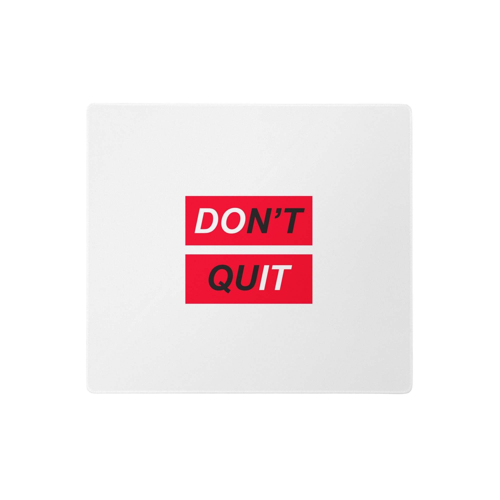 White rectangular polyester mouse pad with bold red graphic and black dont quit motivational text for desk decor